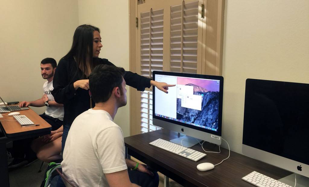 Sara Shields walks a student through a project