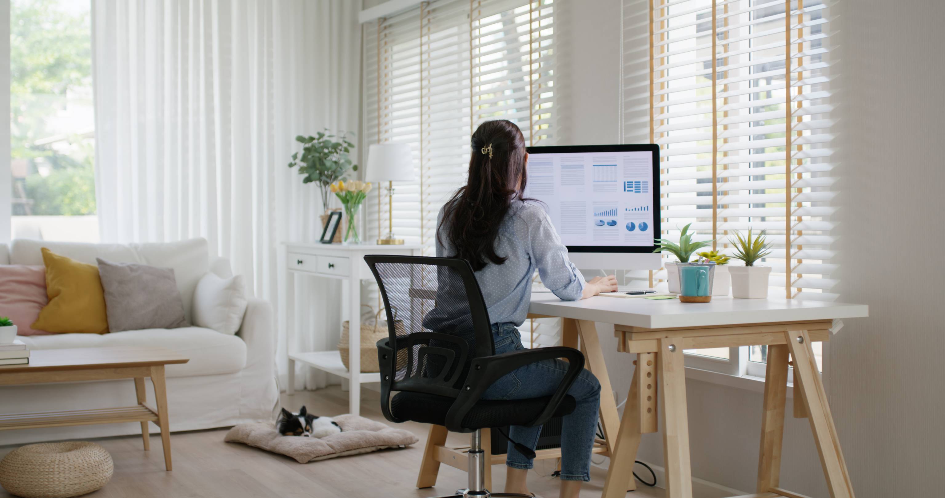 Woman working at home PC. 
