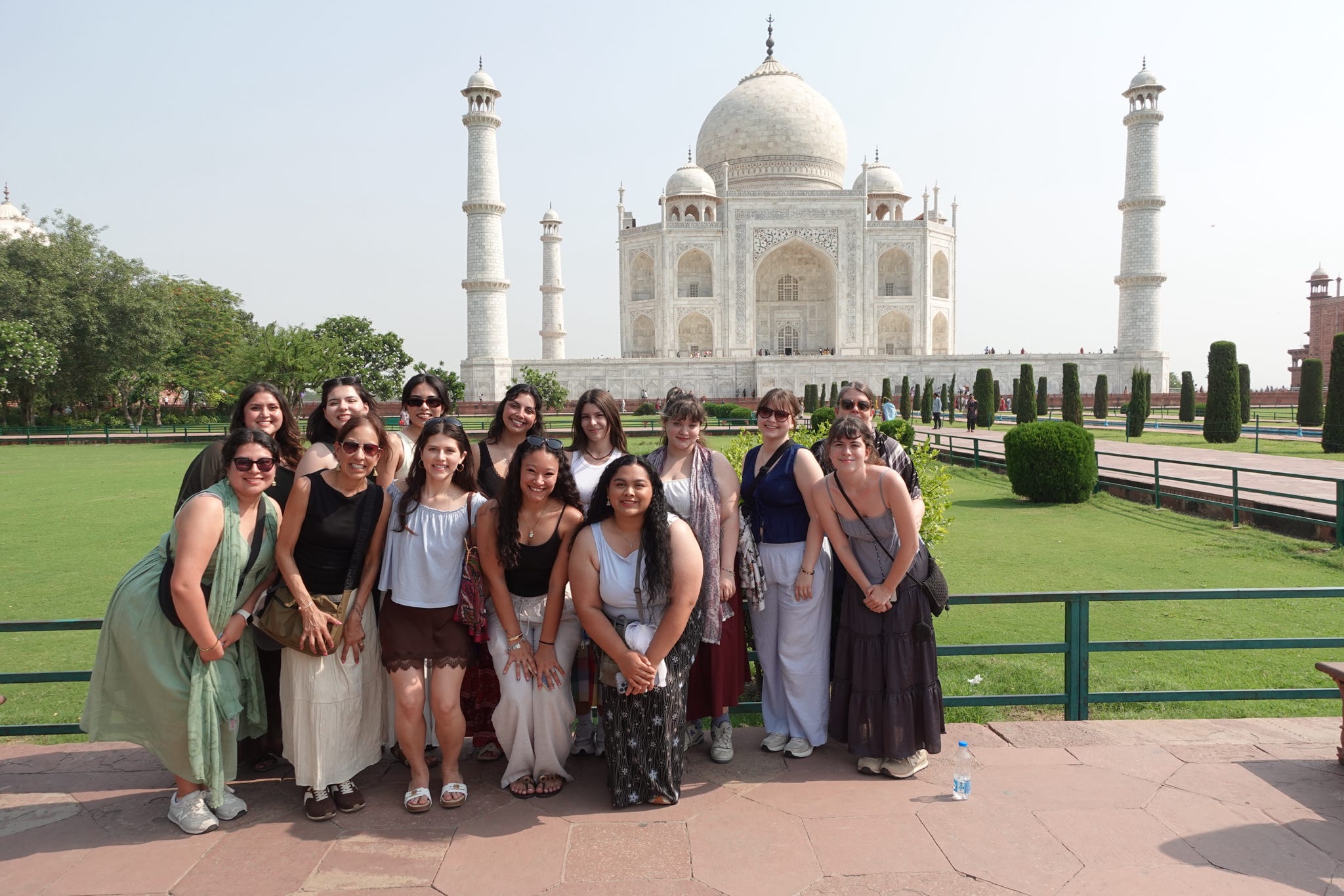 TXST HDFS students and faculty stand in front of the Taj Mahal