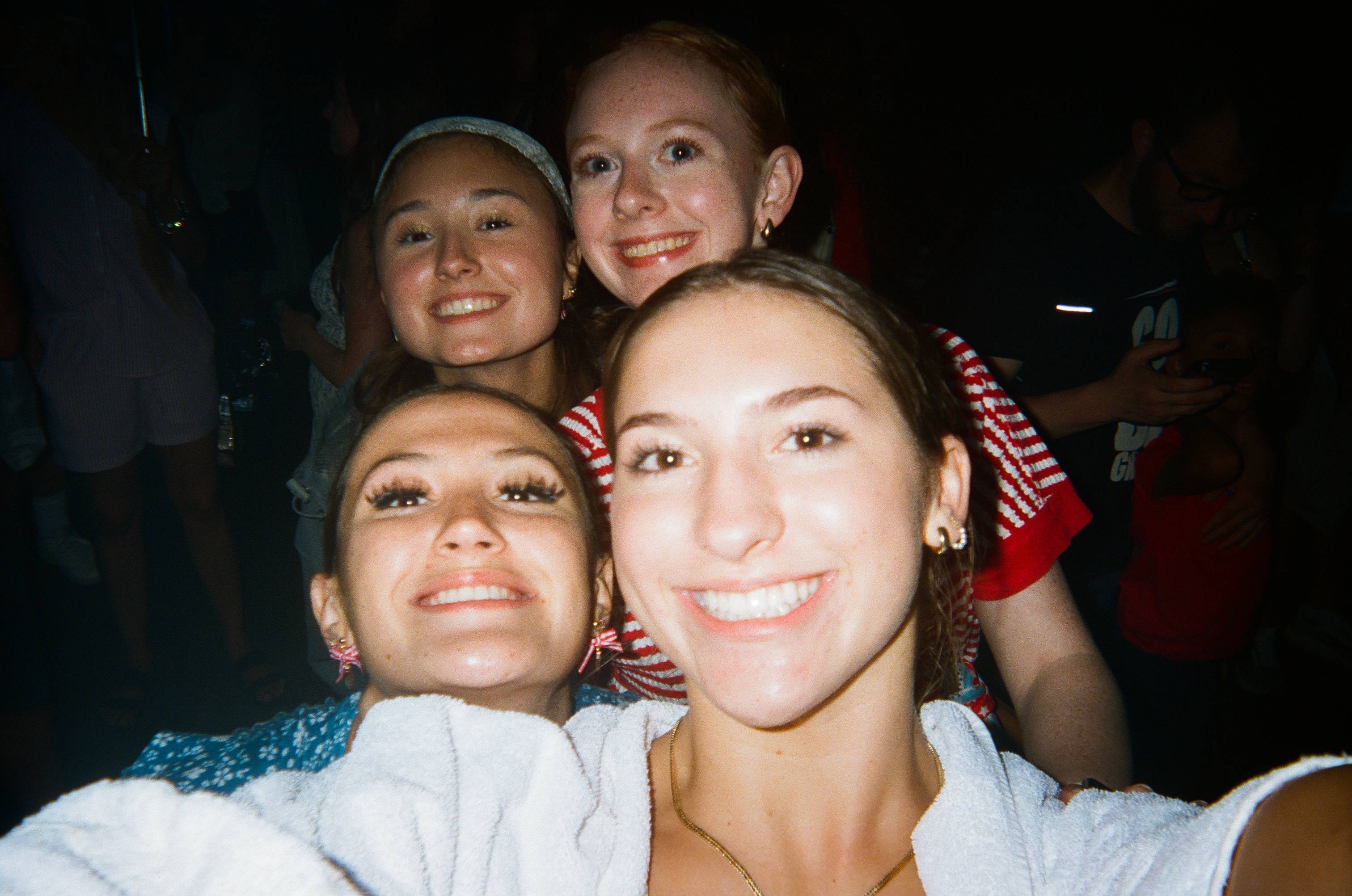 four female students take a selfie 