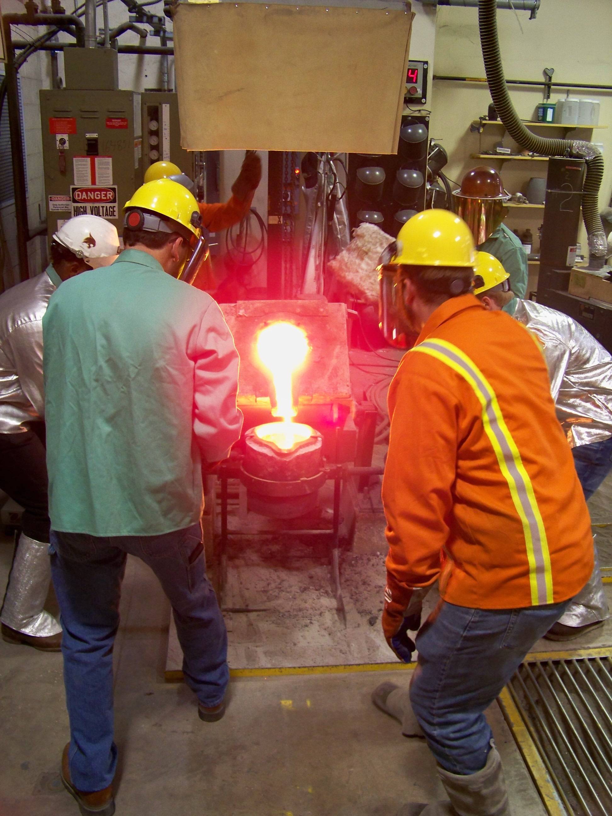group pouring molten