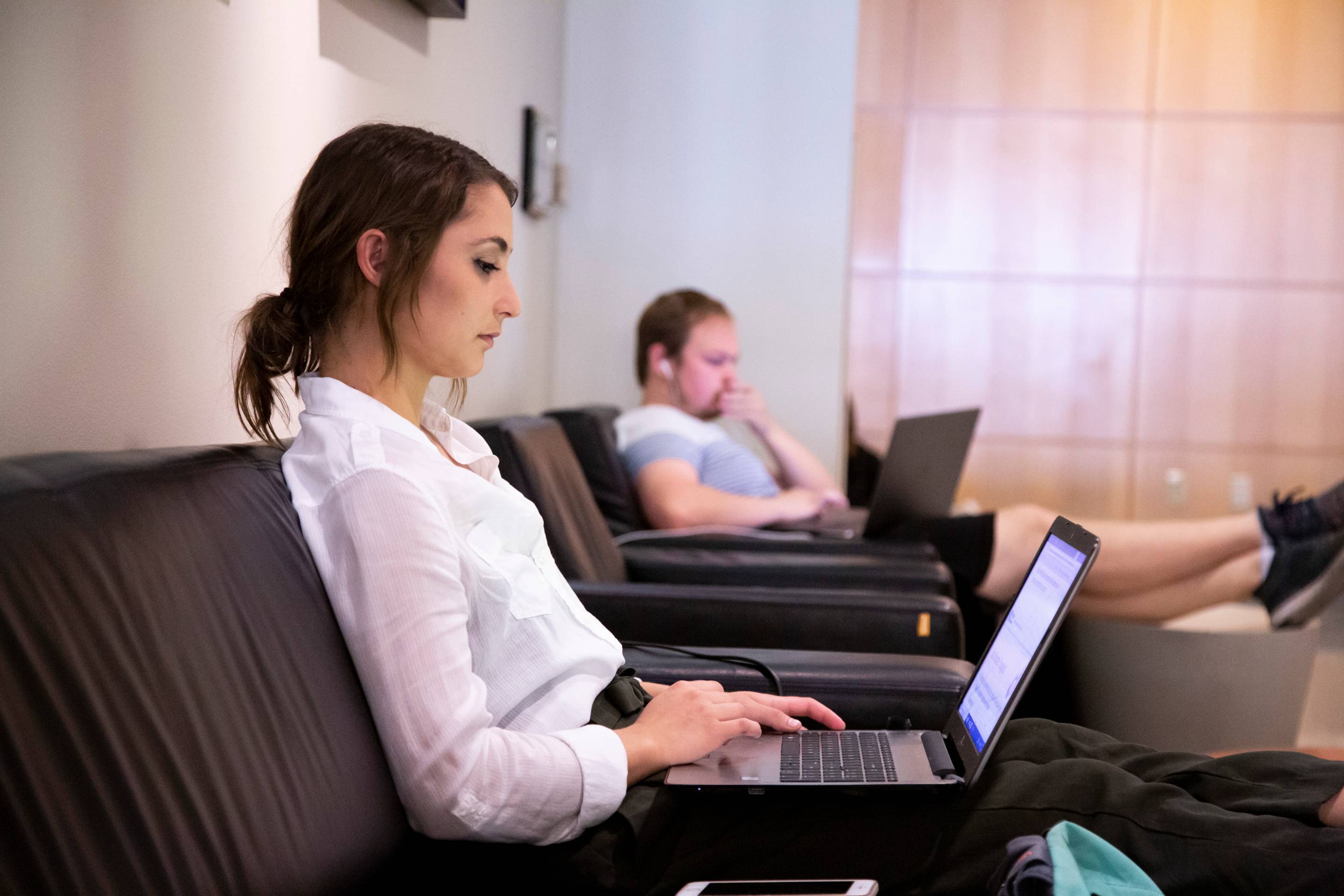 a female student using a laptop