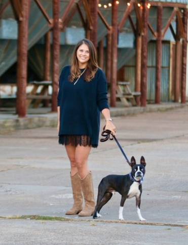 woman posing for photo with small boston terrior