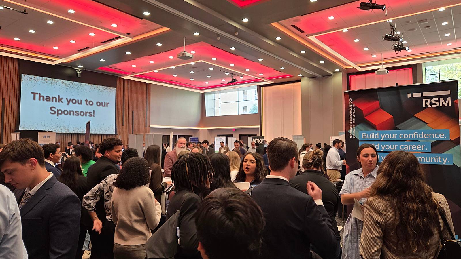 Picture of a crowd of students and recruiters attending Meet the Firms 2025.