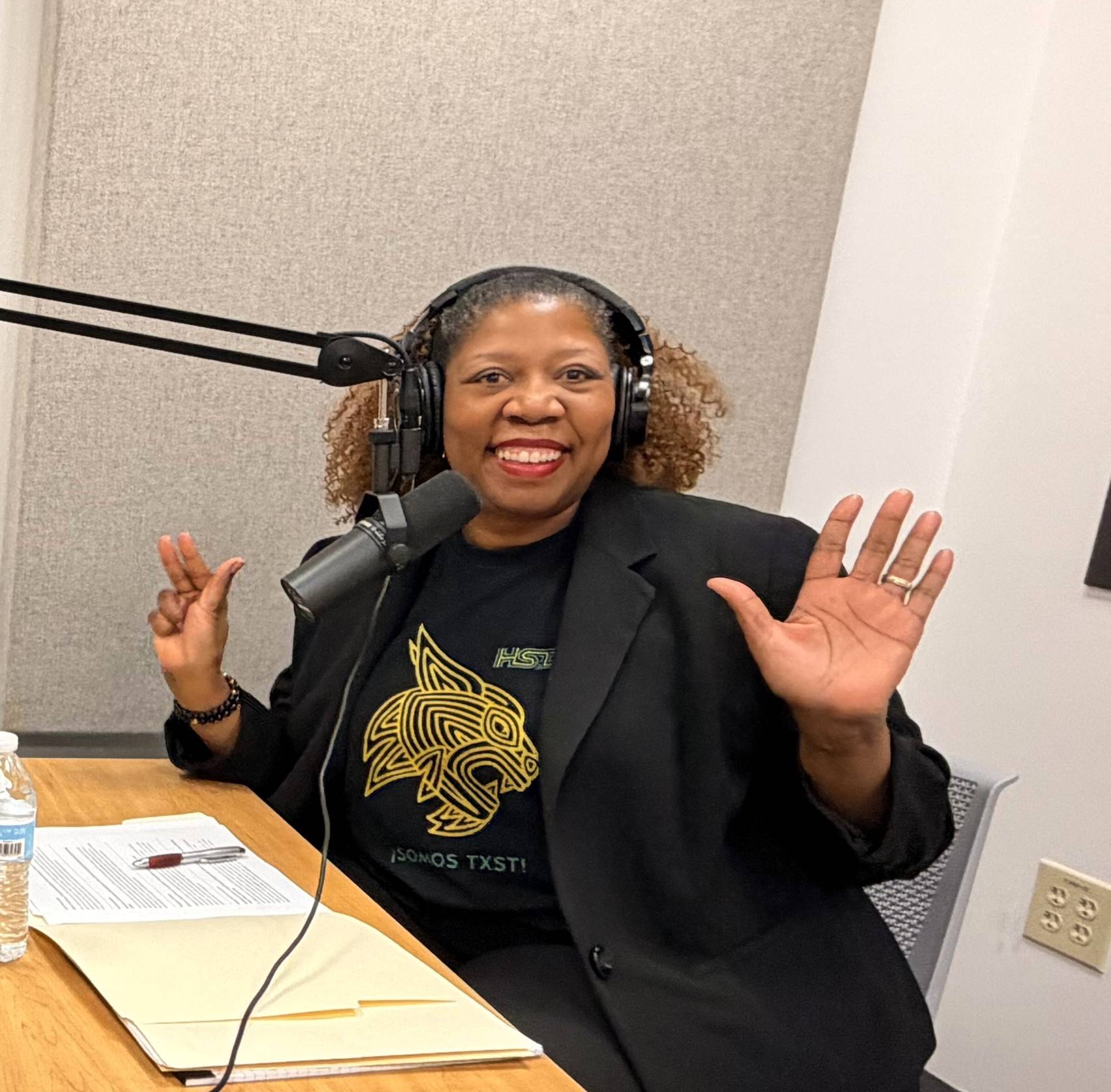 photo of dr shetay ashford-hanserd at podcast desk with mic