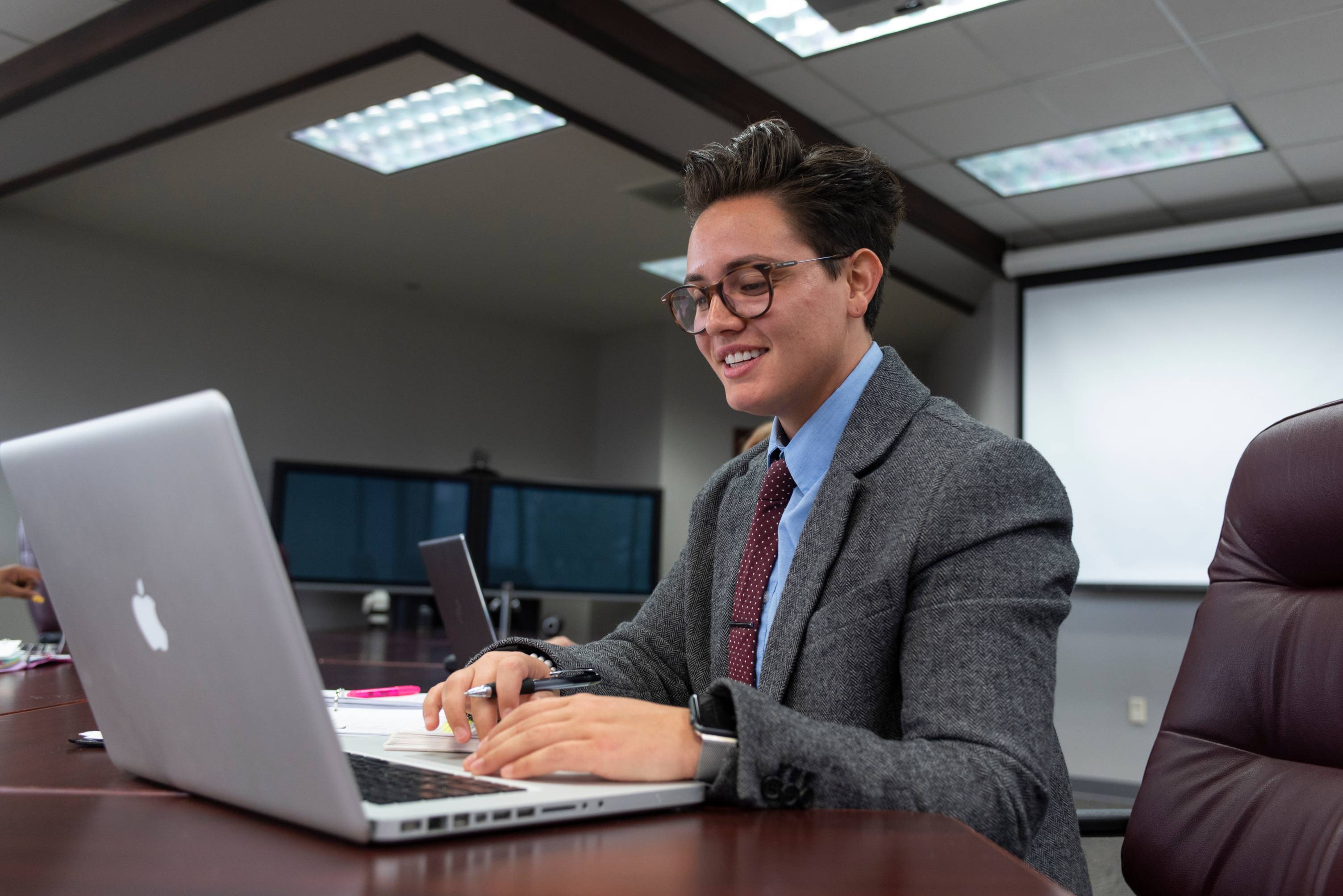 photo of professional individual on laptop
