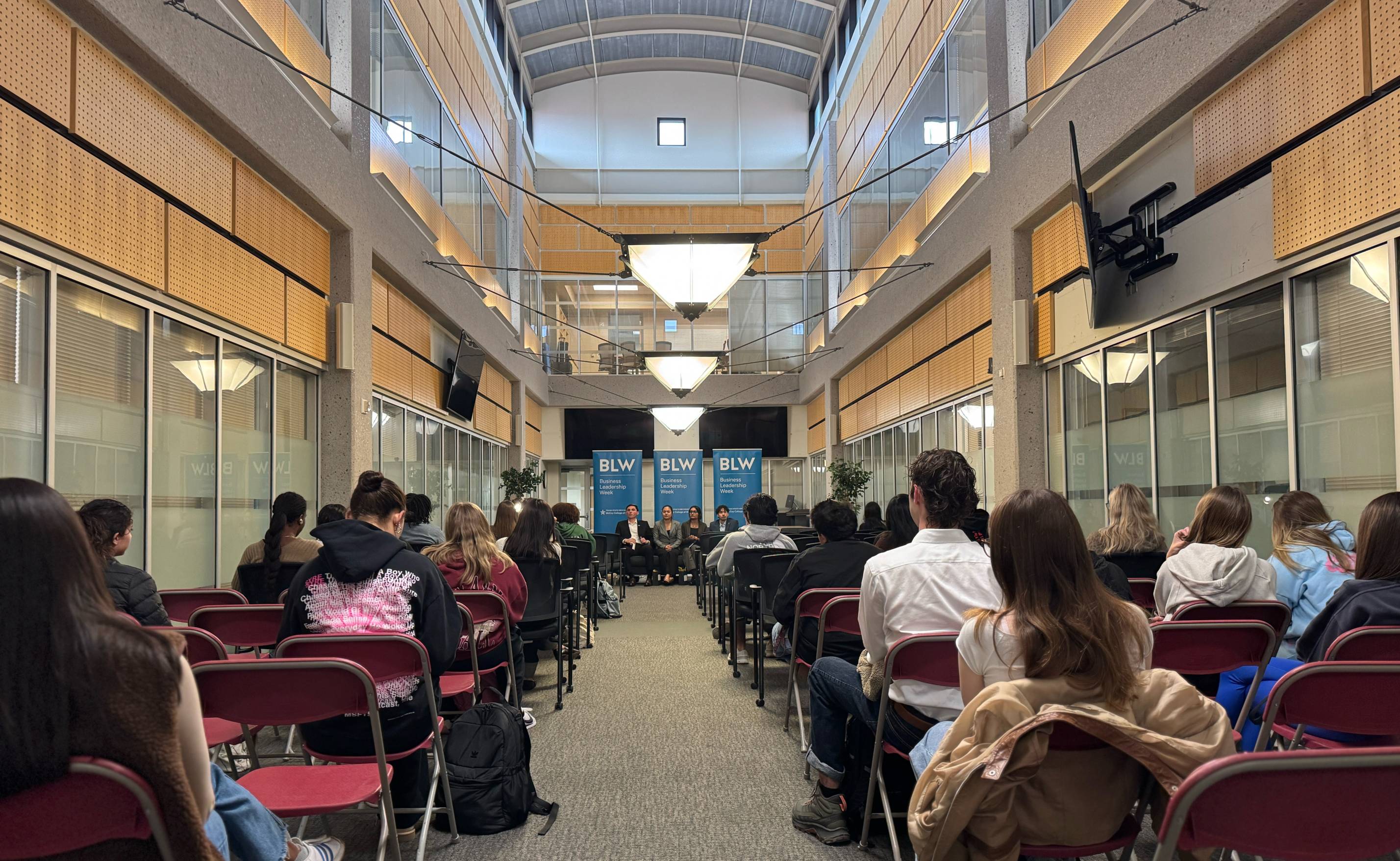 Group of students listening to speakers
