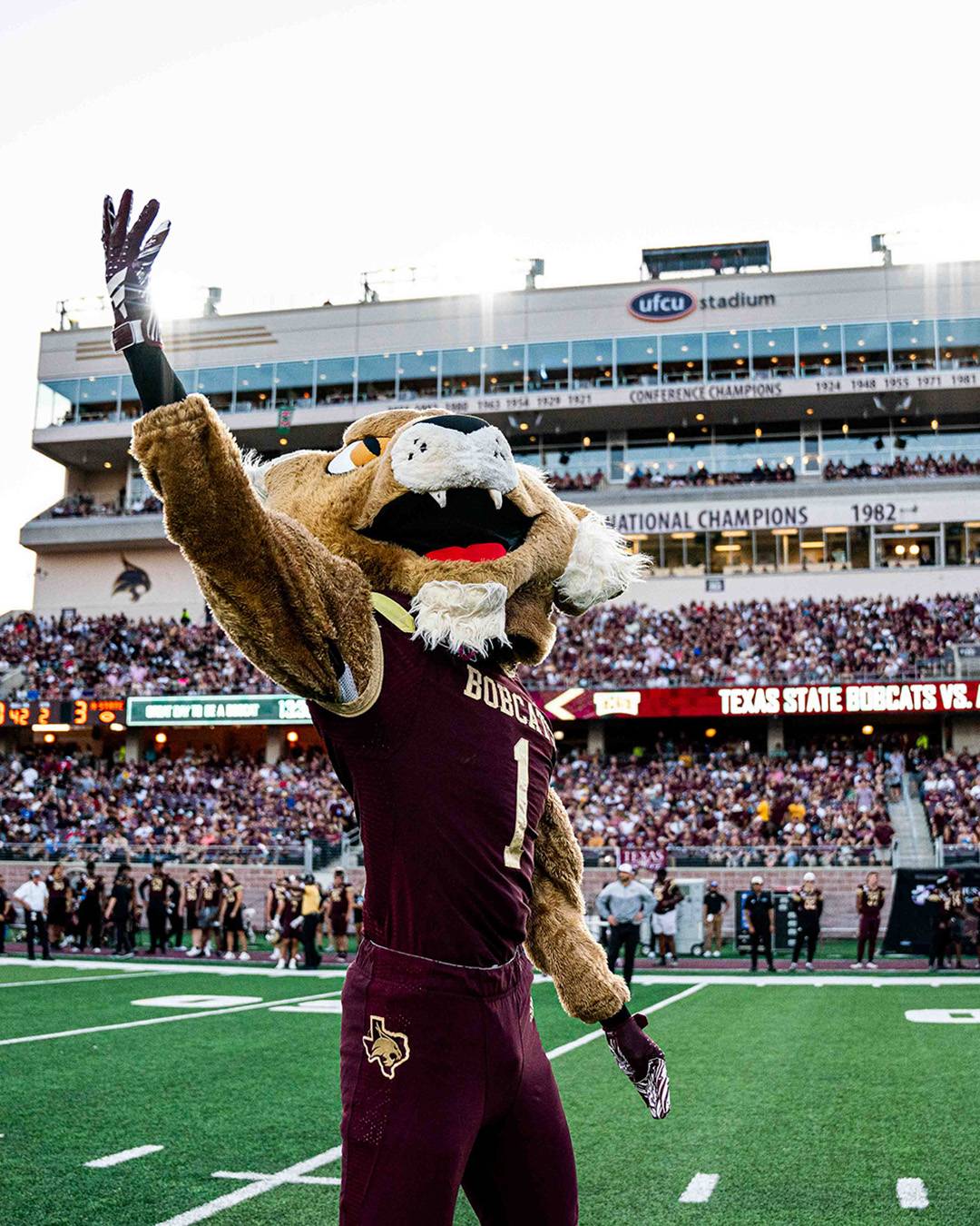 Boko the Bobcat in a packed UFCU stadium