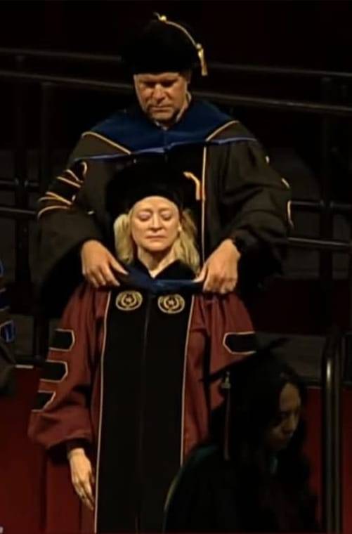 Heather being hooded at commencement