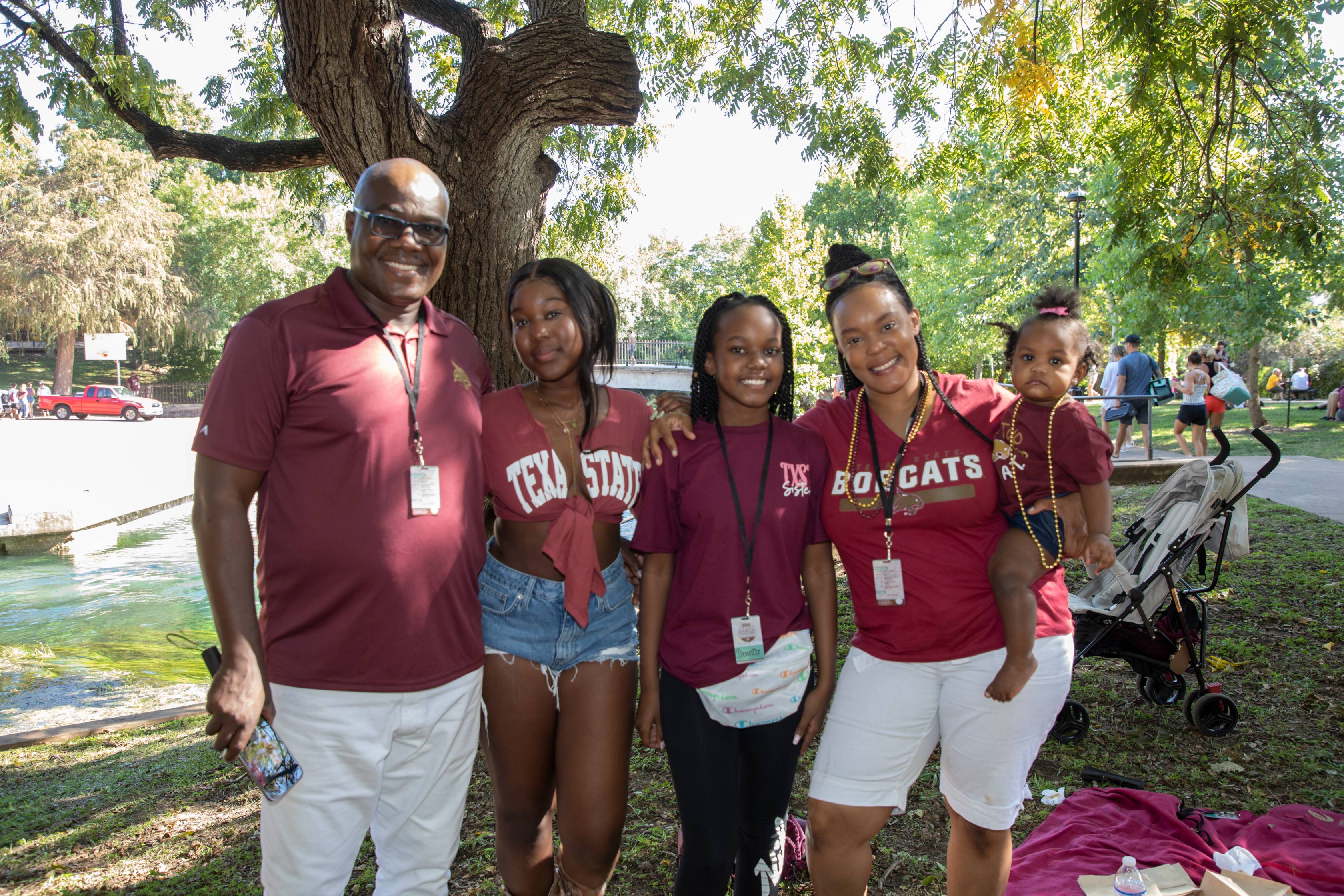family posing together at the park