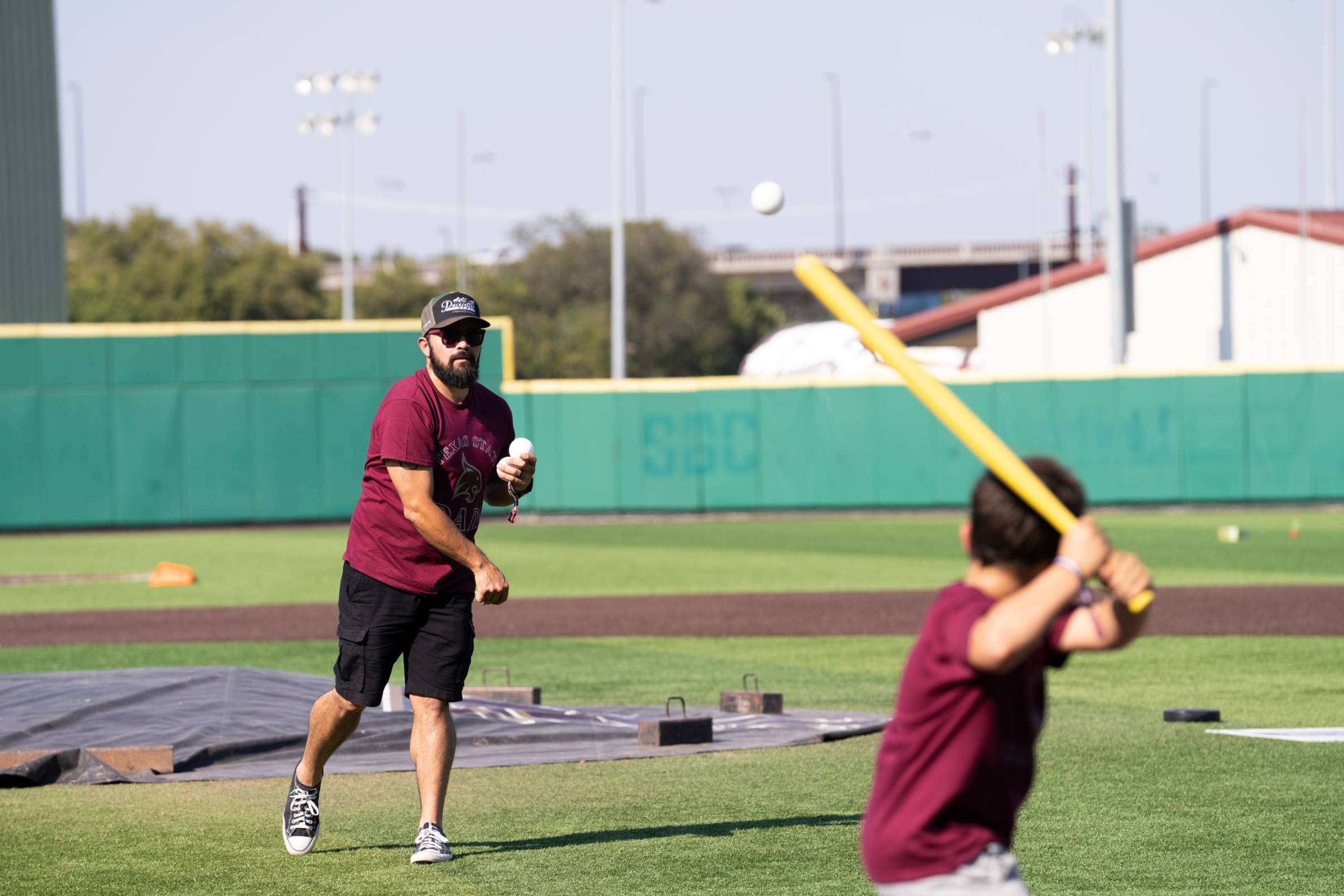 Father and son playing baseball