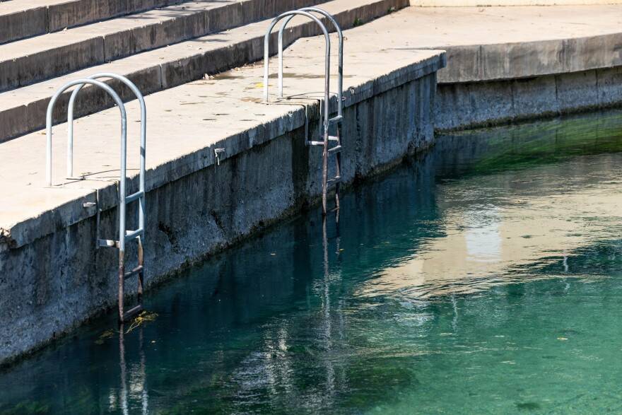 Lines on the wall at Sewell Park show the decreasing depth of the San Marcos River due to the recent drought.