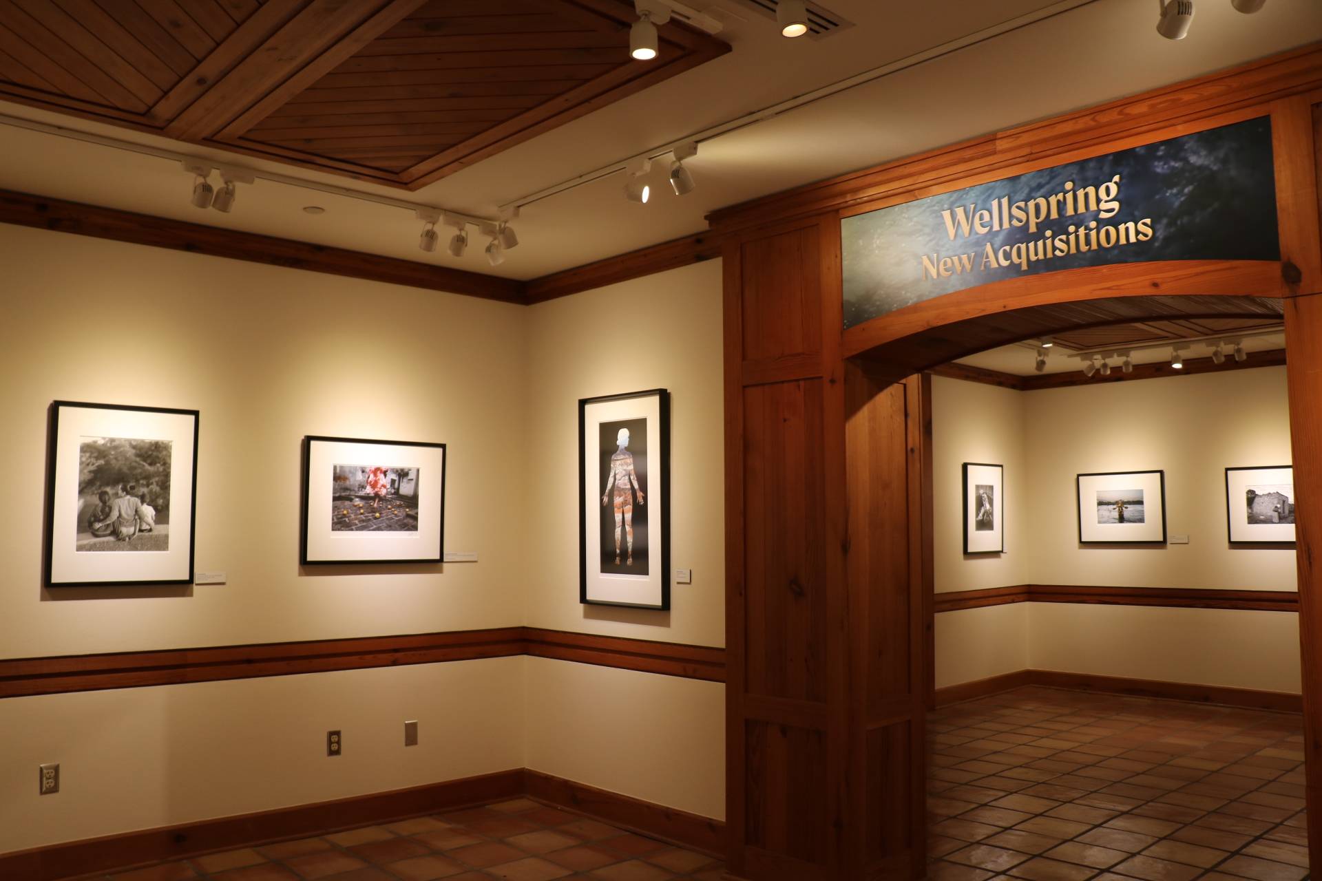 Photo of a Wittliff gallery with pictures hanging.