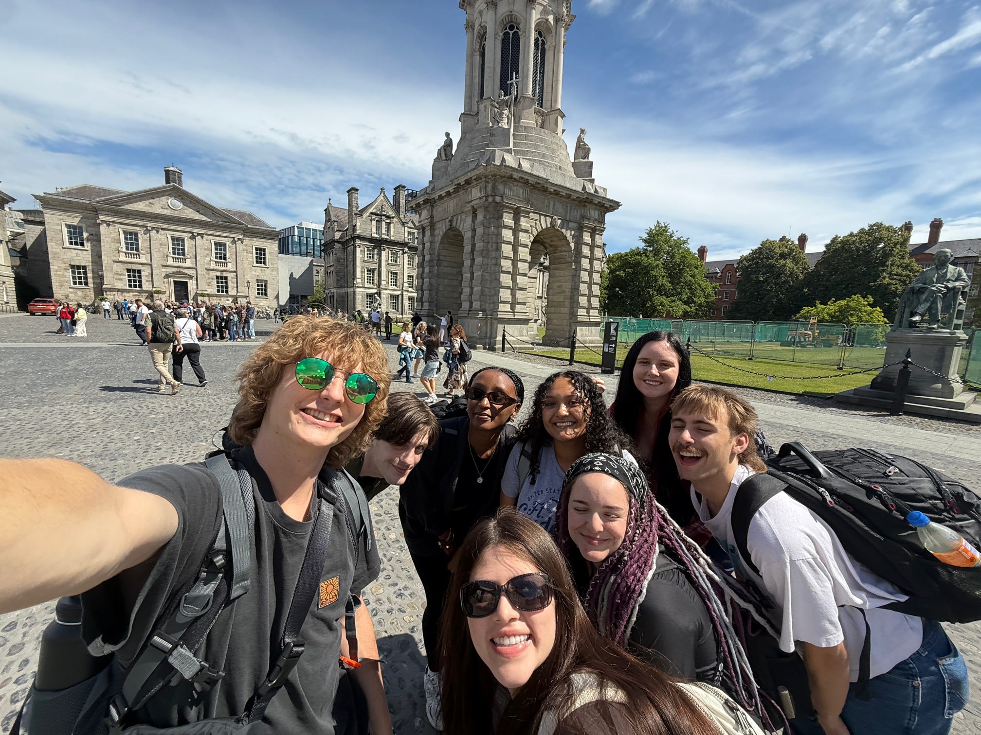 students taking selfie in front of old building