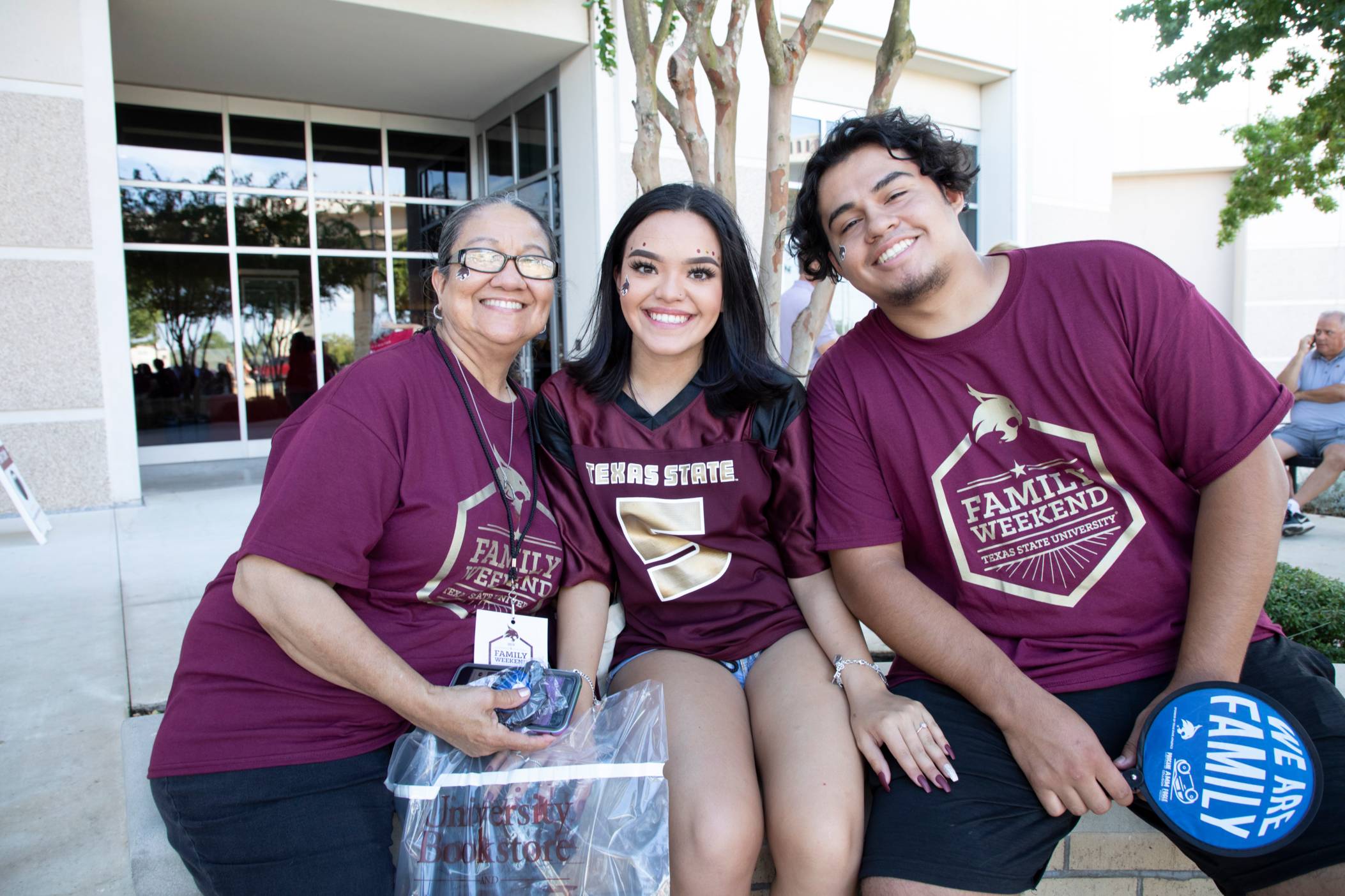 Kid and parent with bobcat fan