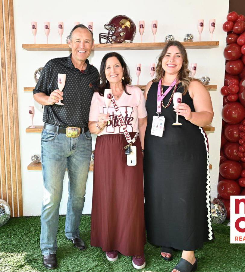 president damphousse poses for photo with his wife and daughter