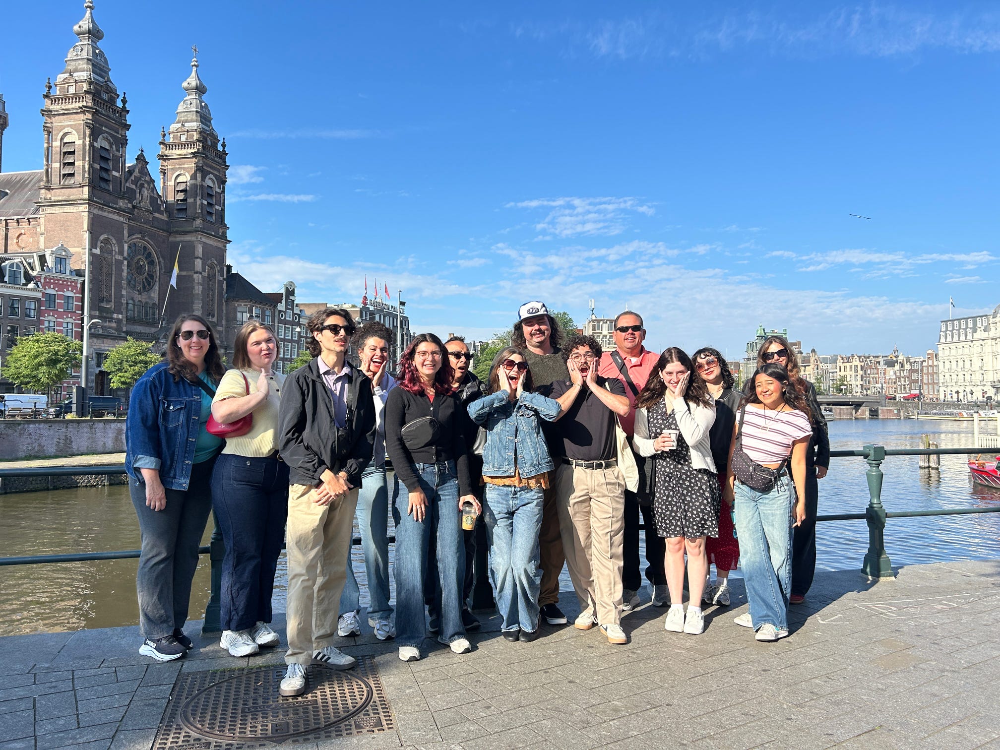 a group of texas state students and staff members standing in front of the Basilica of Saint Nicholas - Amsterdam