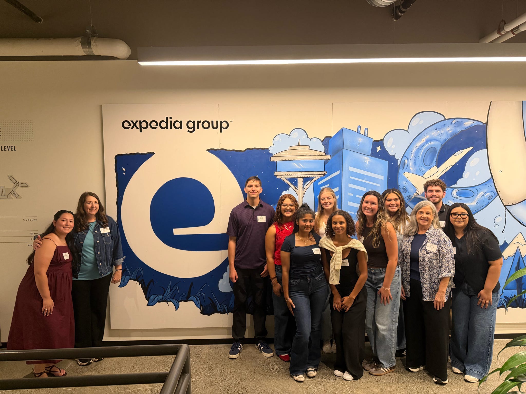 a group of texas state students and staff members posing at Expedia Group - Seattle