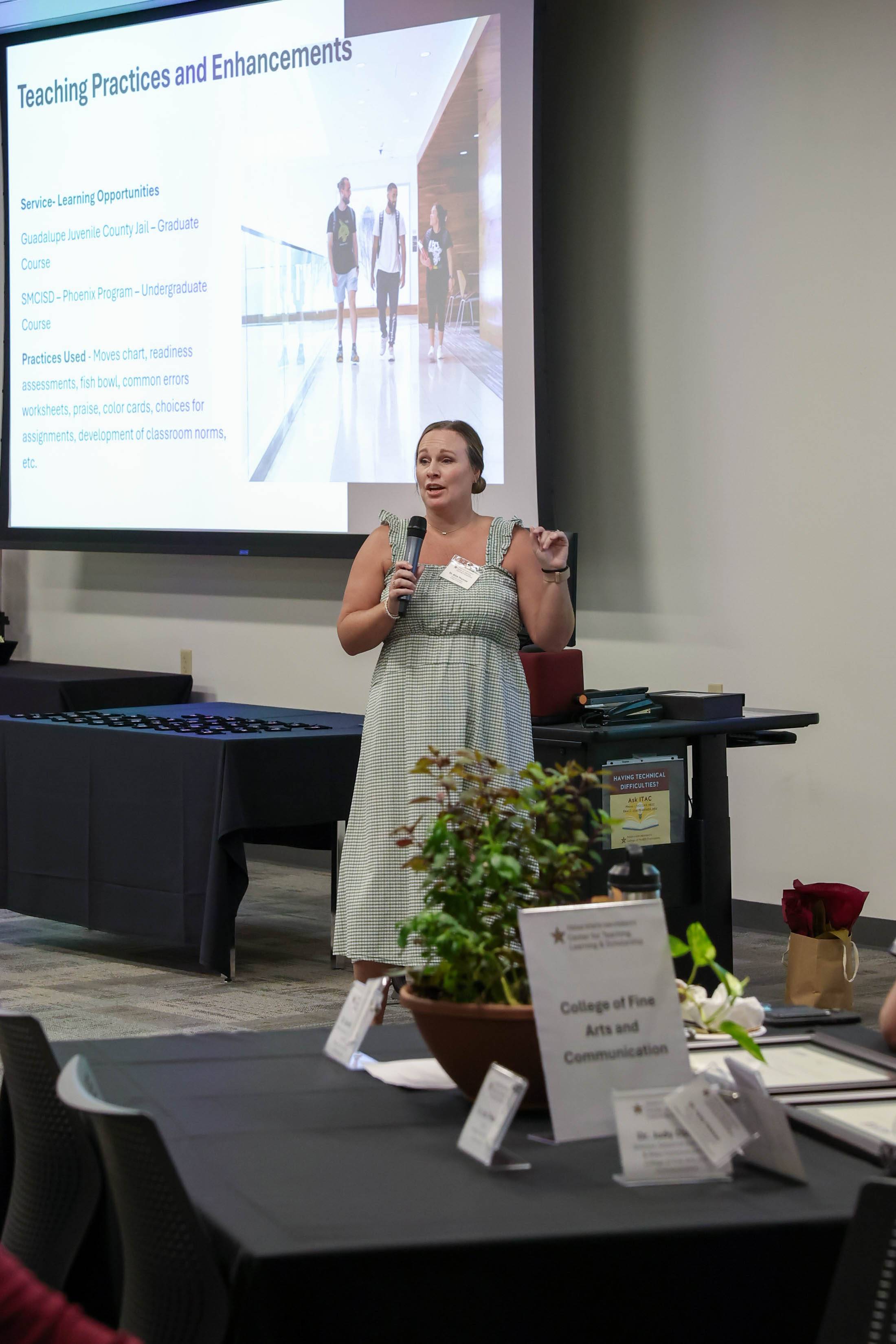 Dr. Allie Thomas, Assistant Professor, delivering remarks at the ACUE Pinning Ceremony