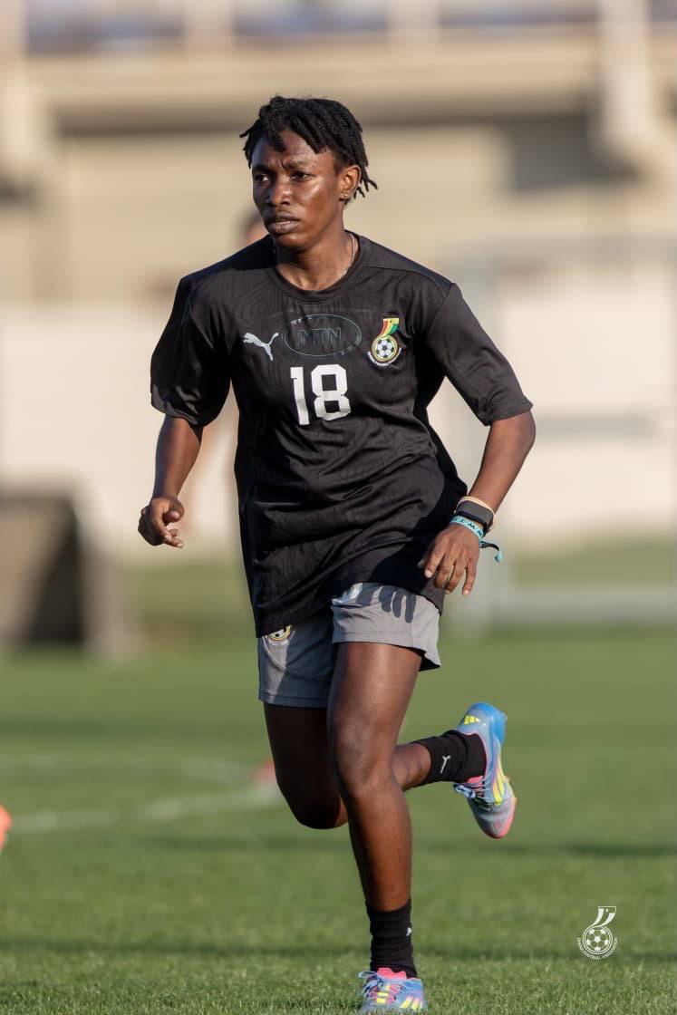 Helen Alormenu runs wearing her uniform playing for Ghana.
