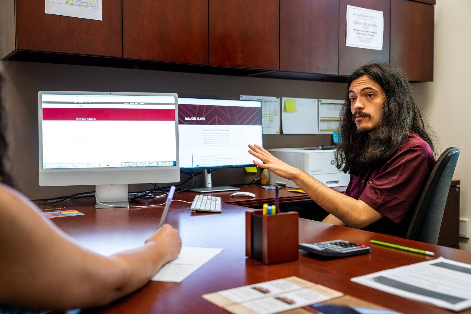 Academic advisor meeting with a student