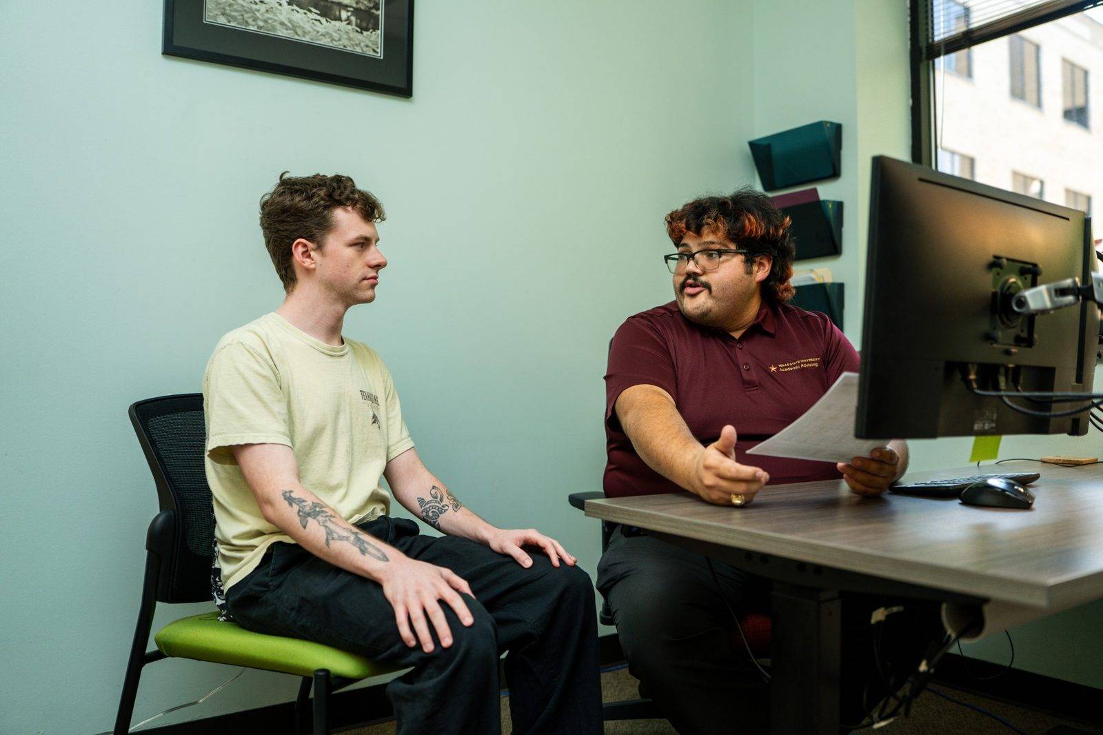 Academic advisor meeting with a student. 