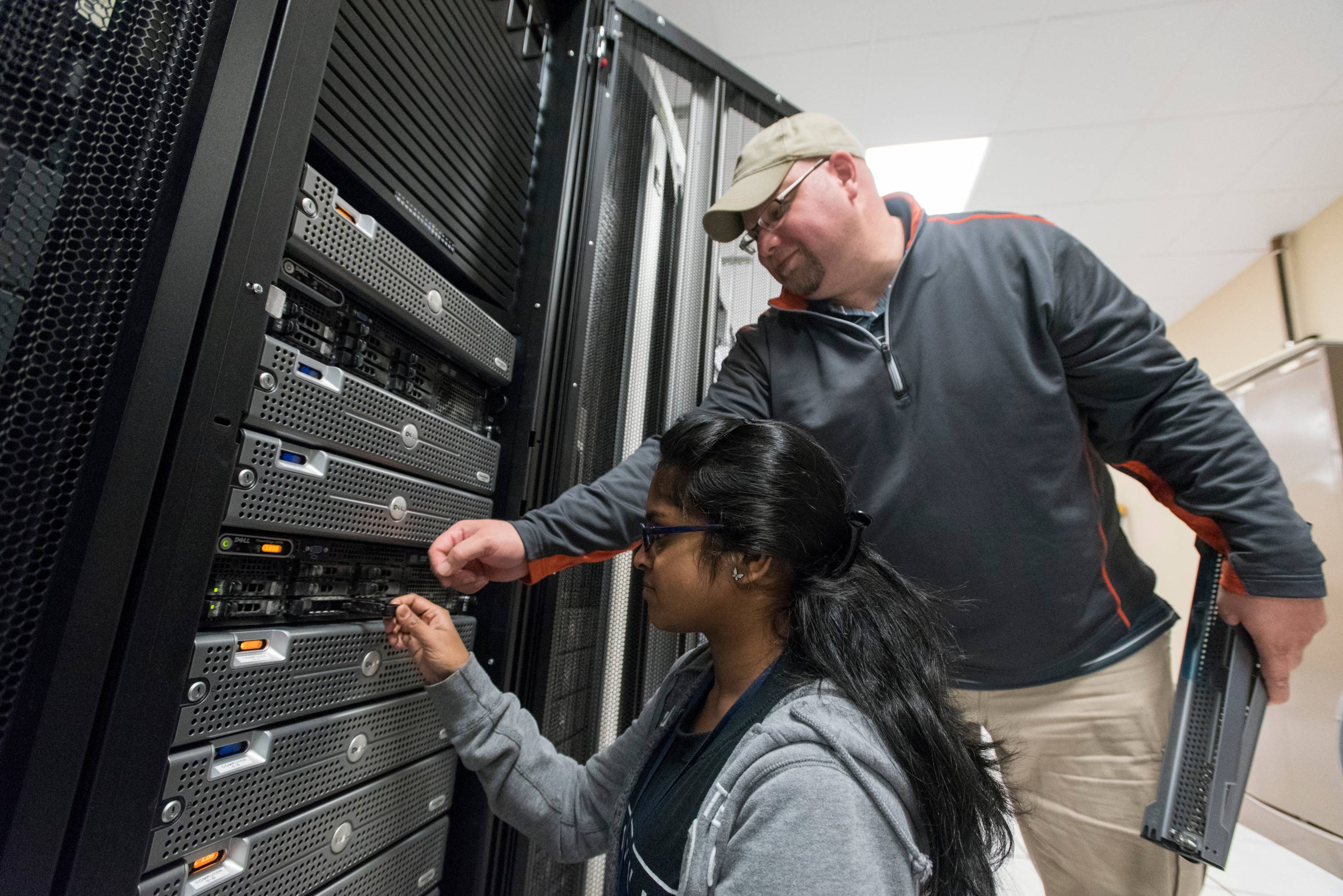 staff replacing computer equipment