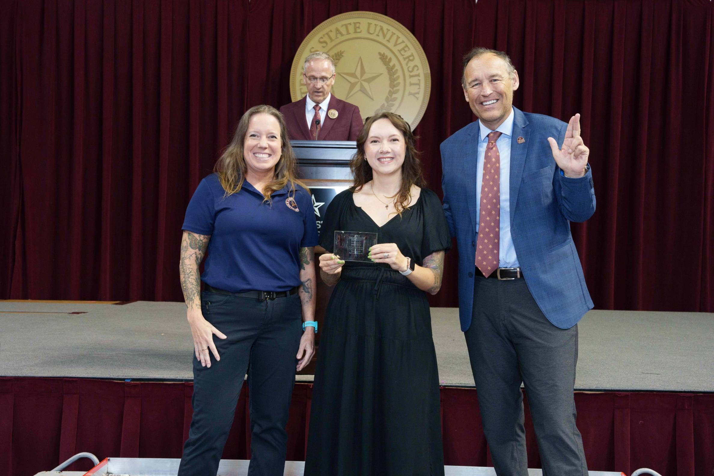 Ashley Rich, AAIII, pictured with President Kelly Damphousse