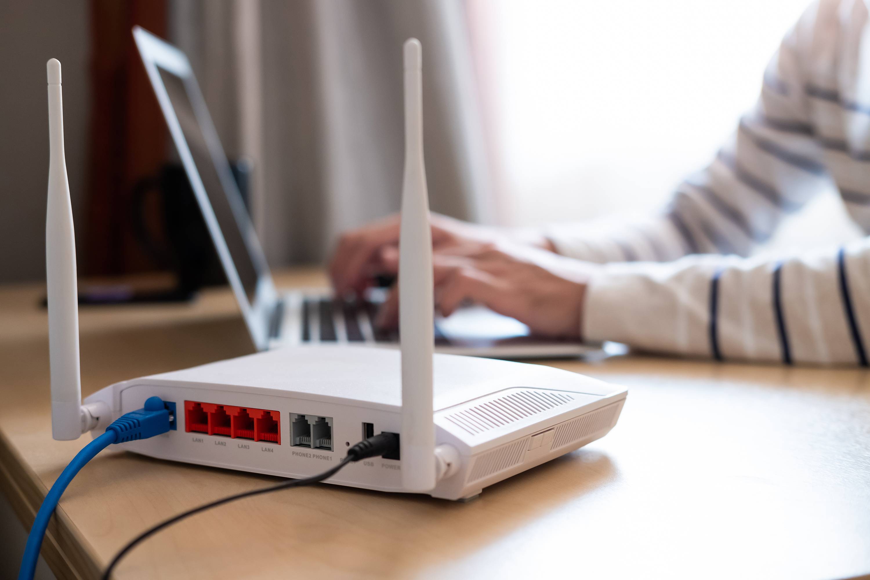 home wifi router sitting on wooden table