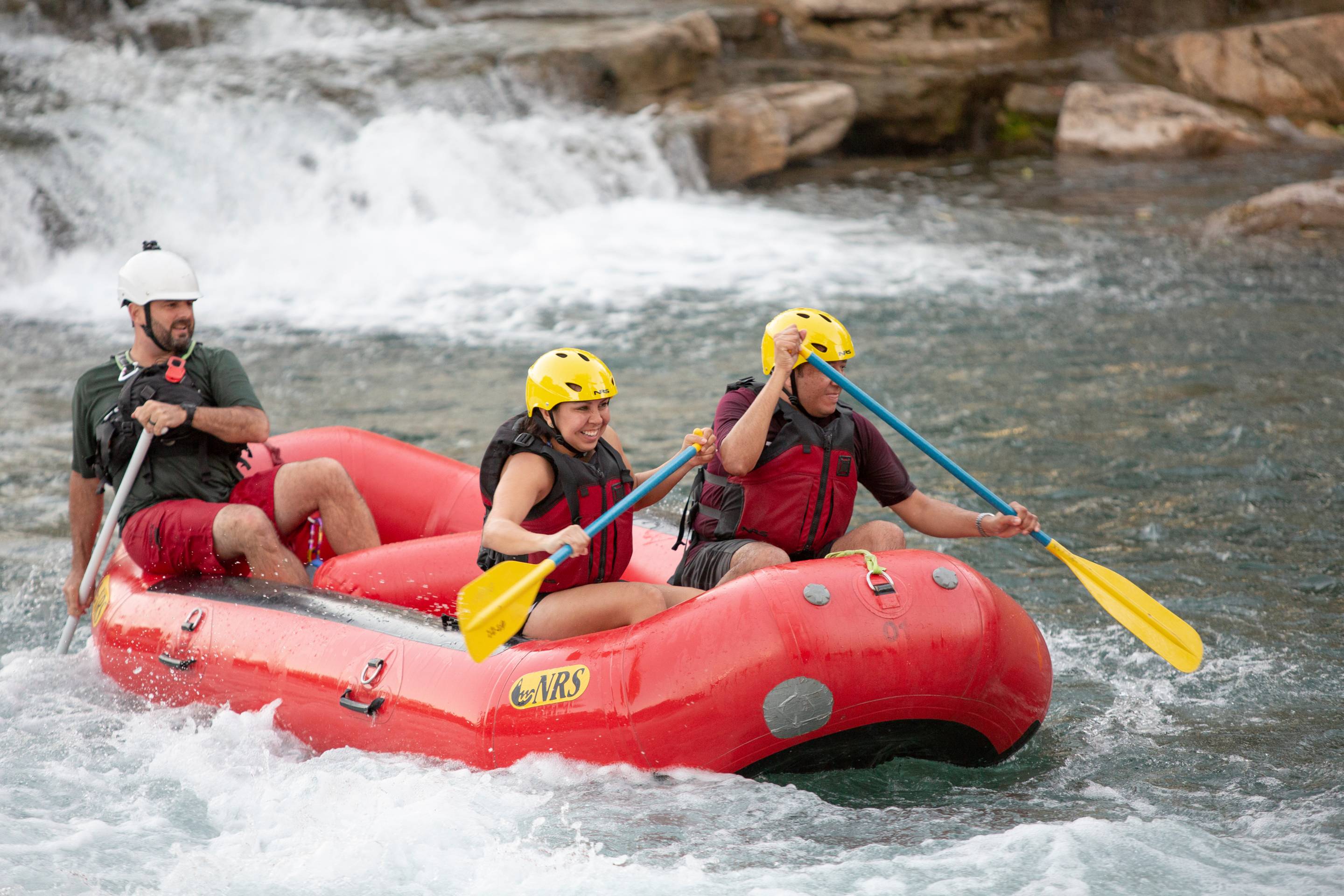 students rafting near falls
