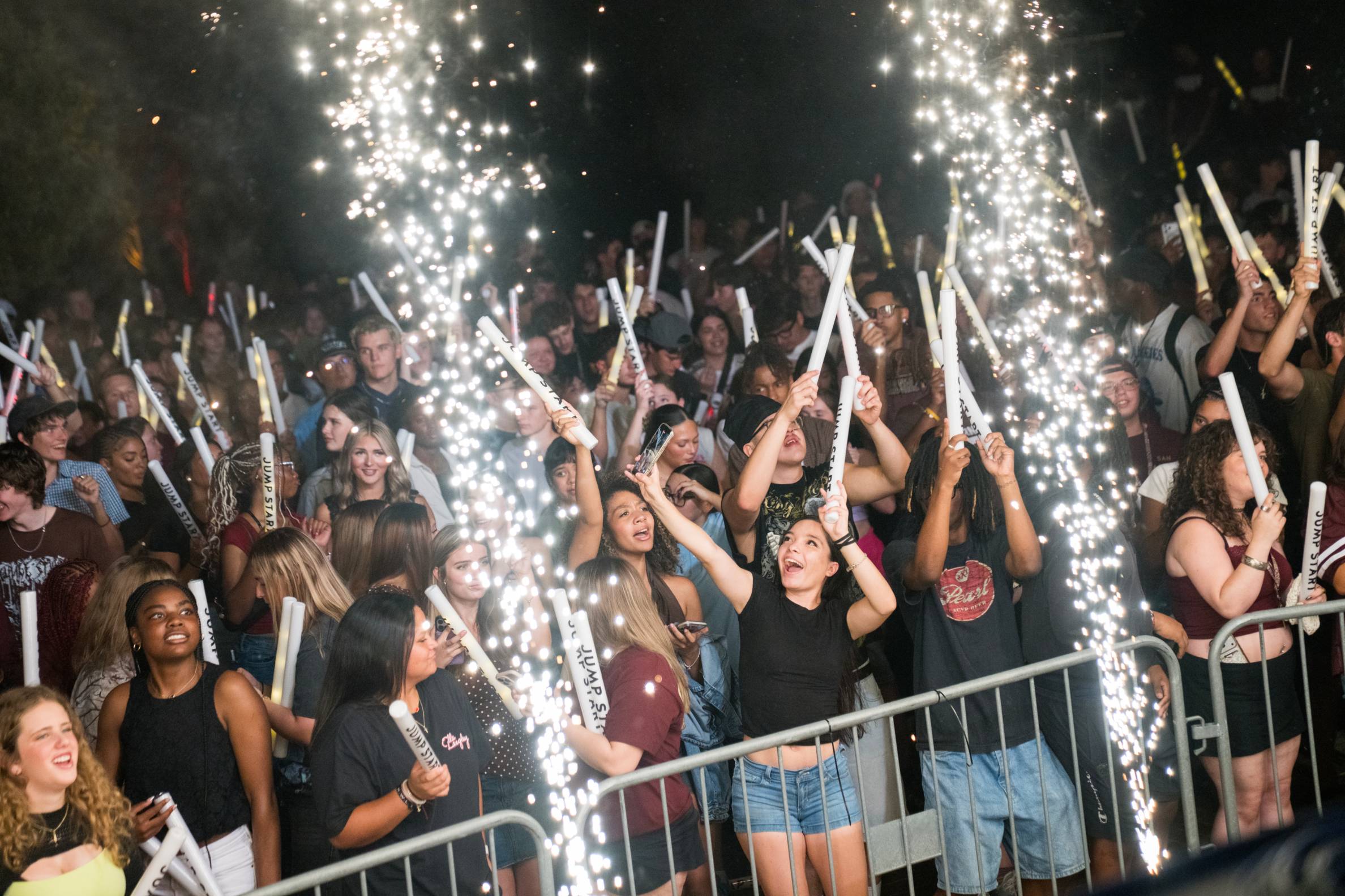 Students enjoying jump start with sparklers 