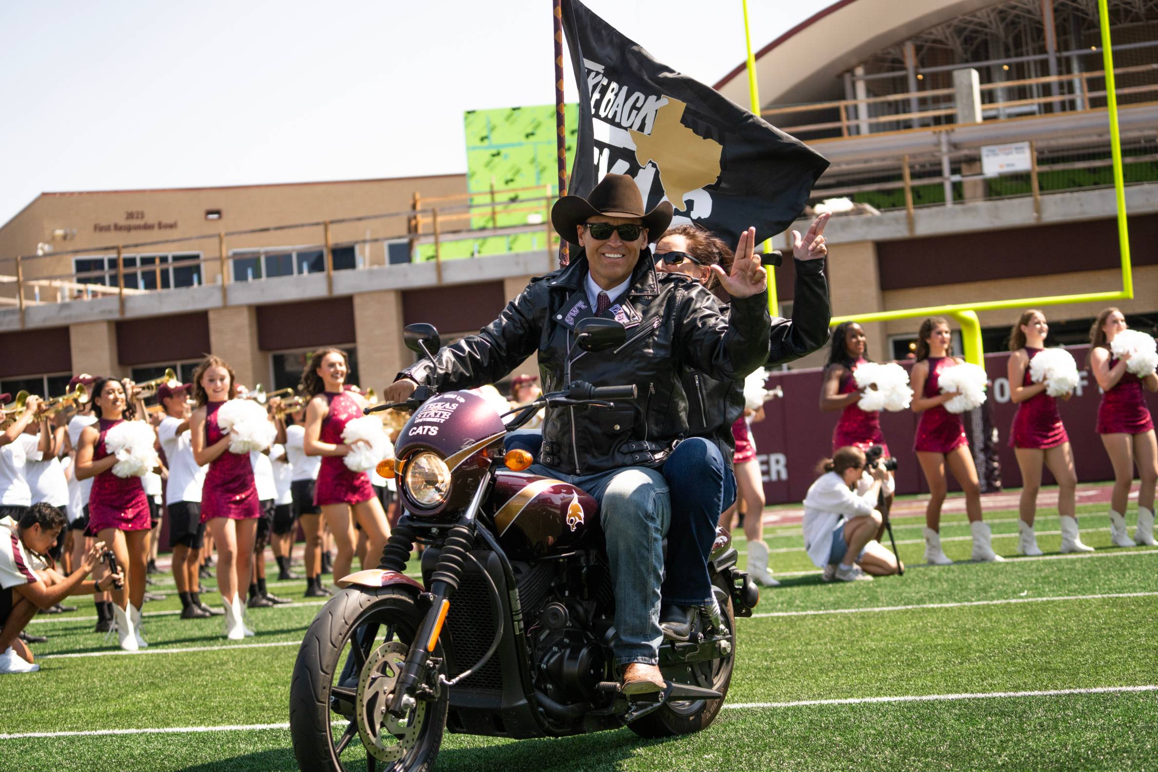 President riding a motorcycle
