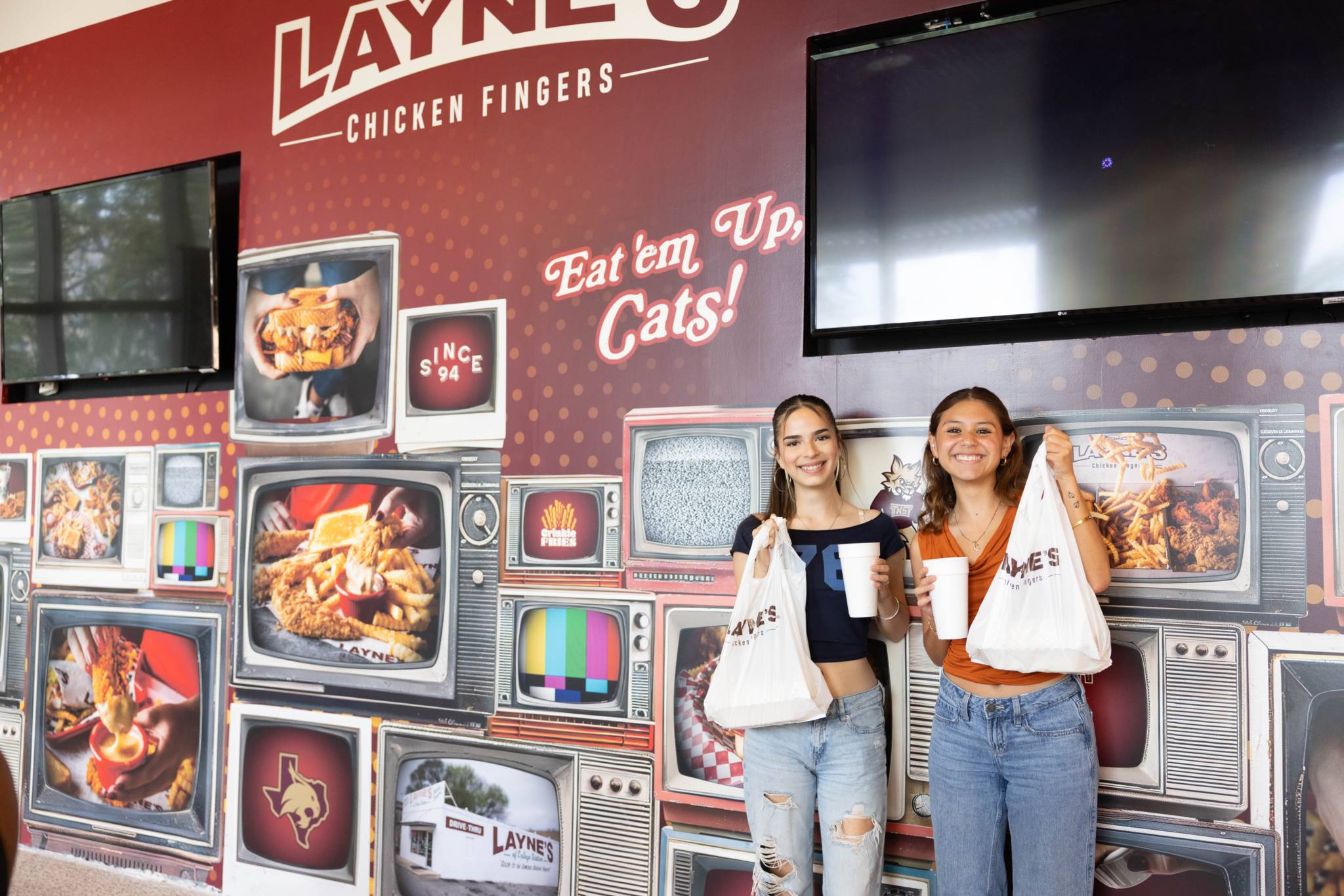 female students holding Layne's 