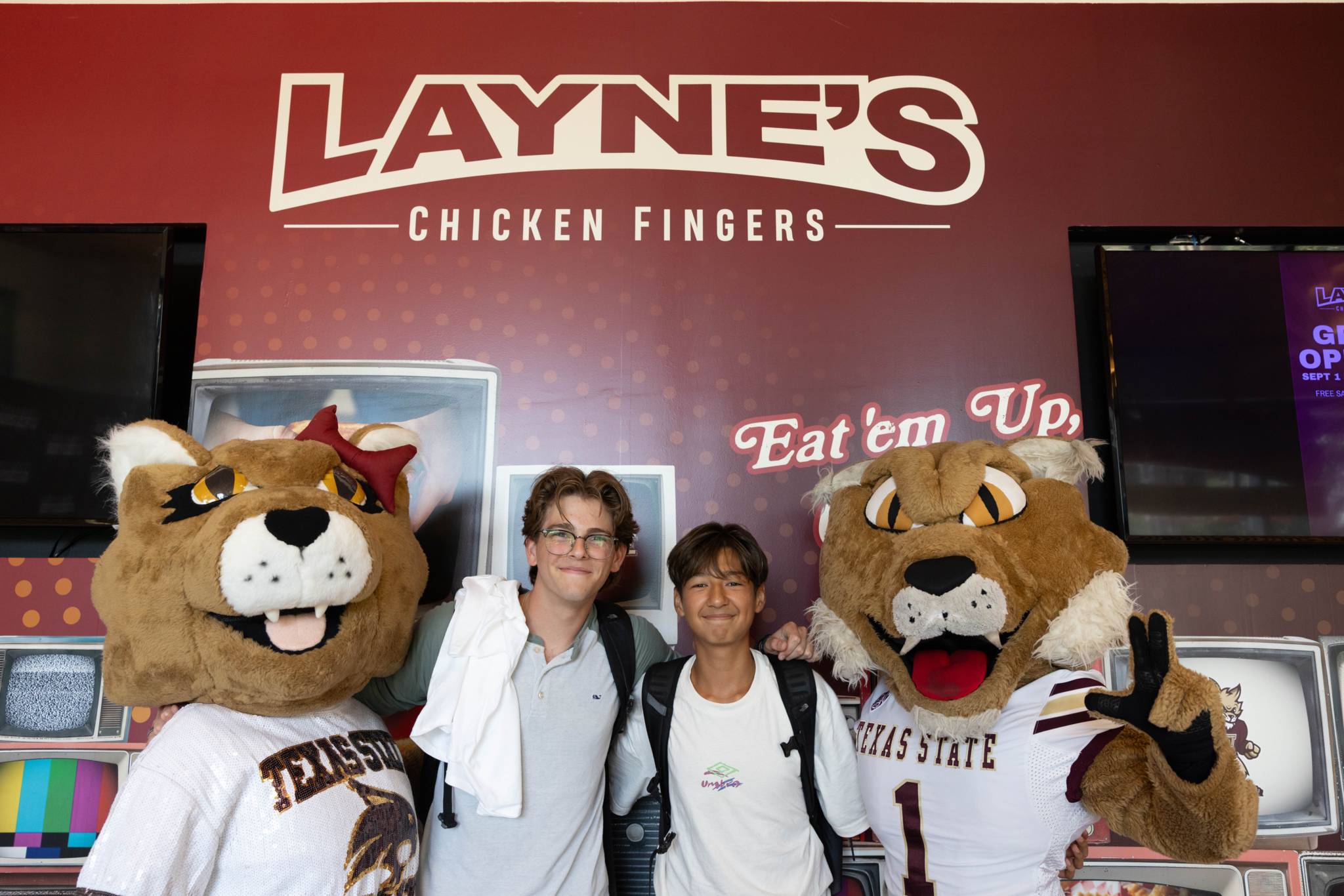 students with boko and koko at sign