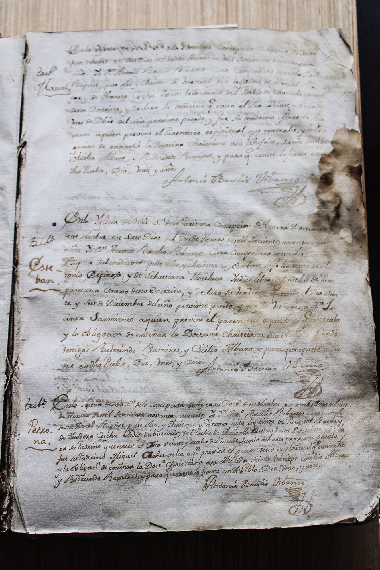 A hand written, stained piece of paper from the 18th century.