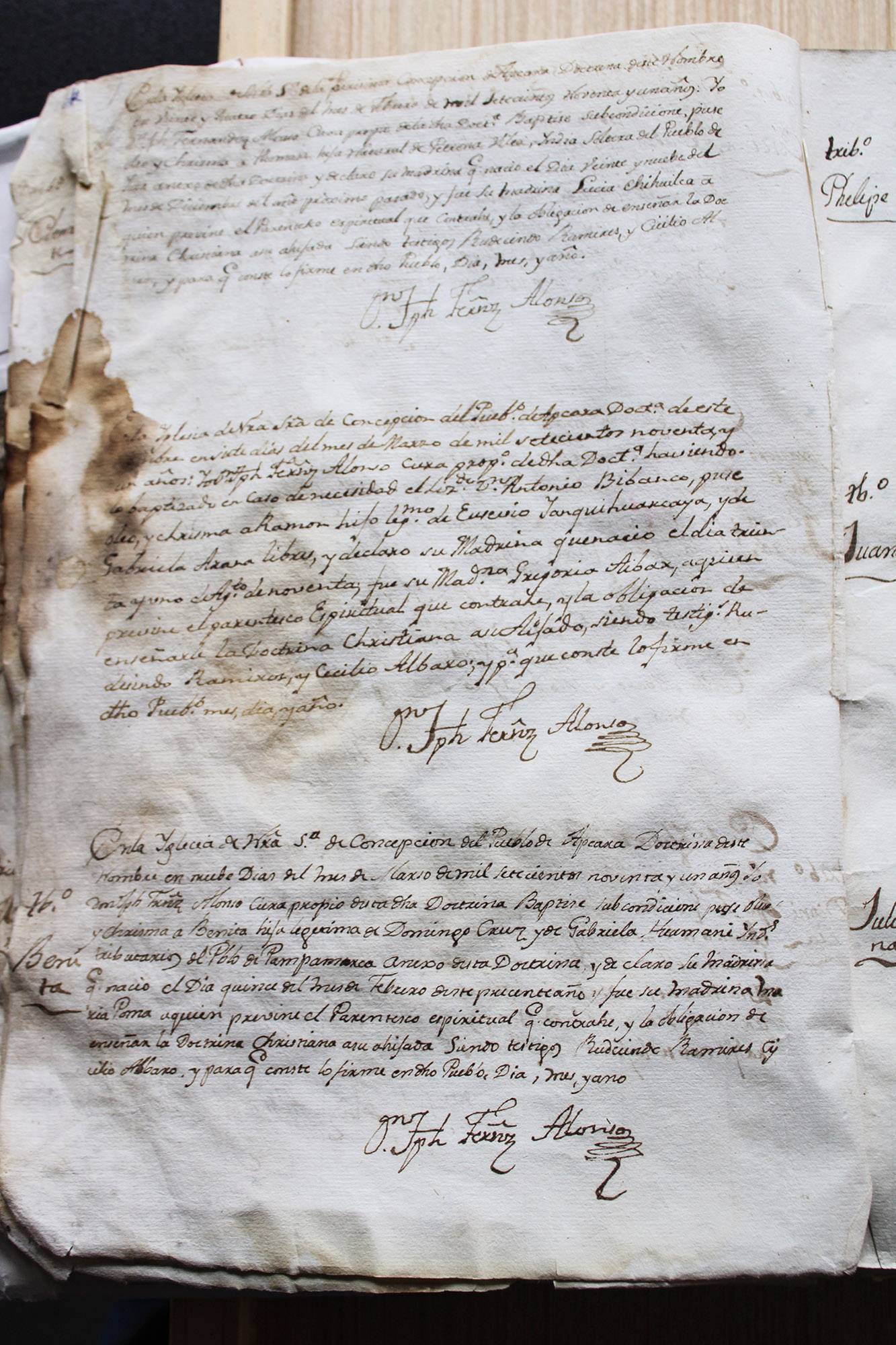 A hand written, stained piece of paper from the 18th century.