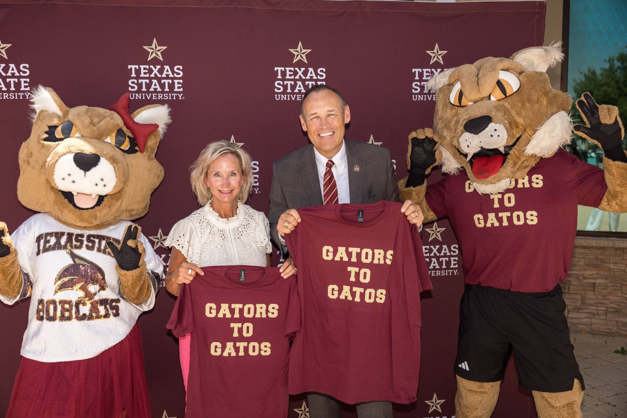 students stand with college leadership