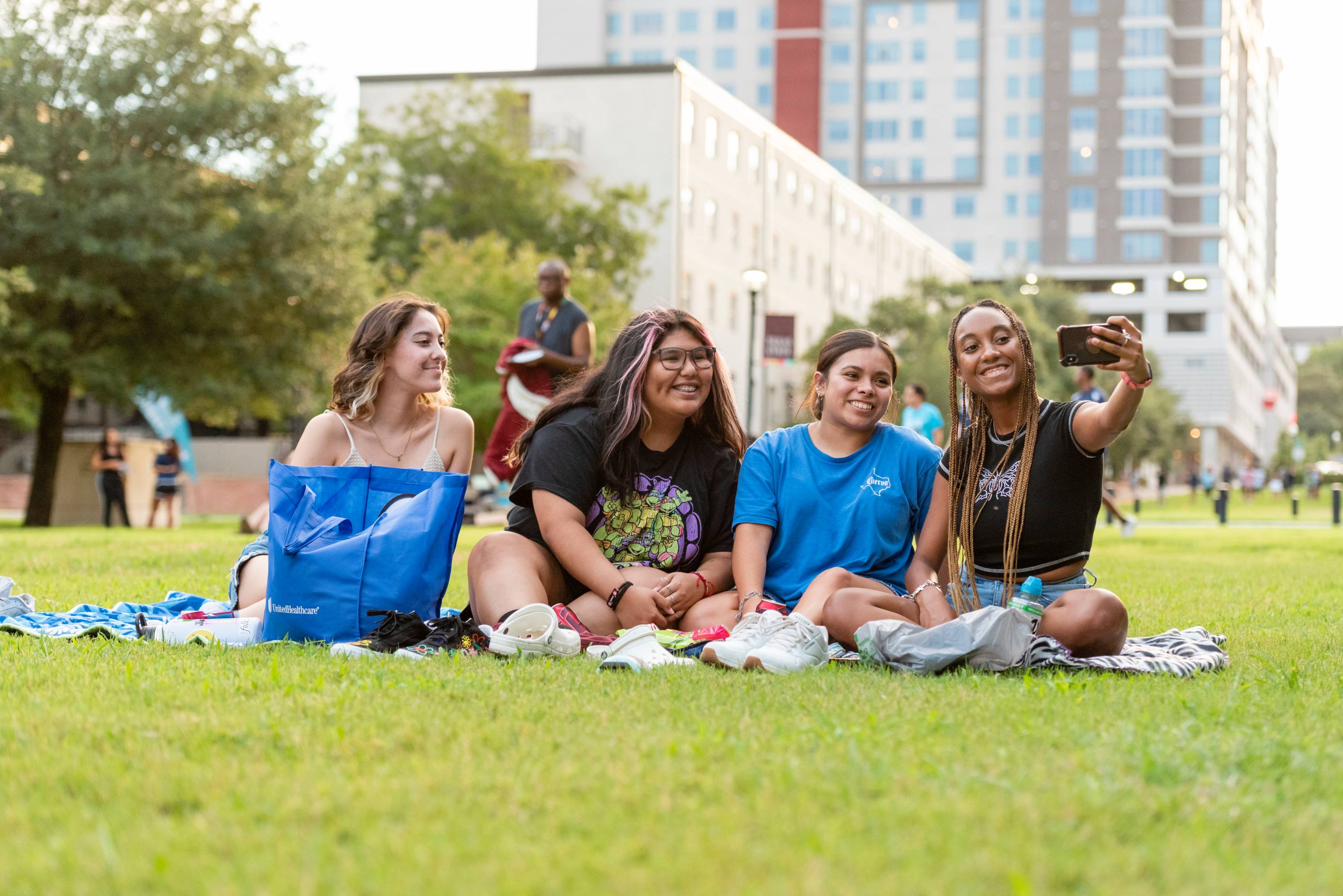 students stand with college leadership