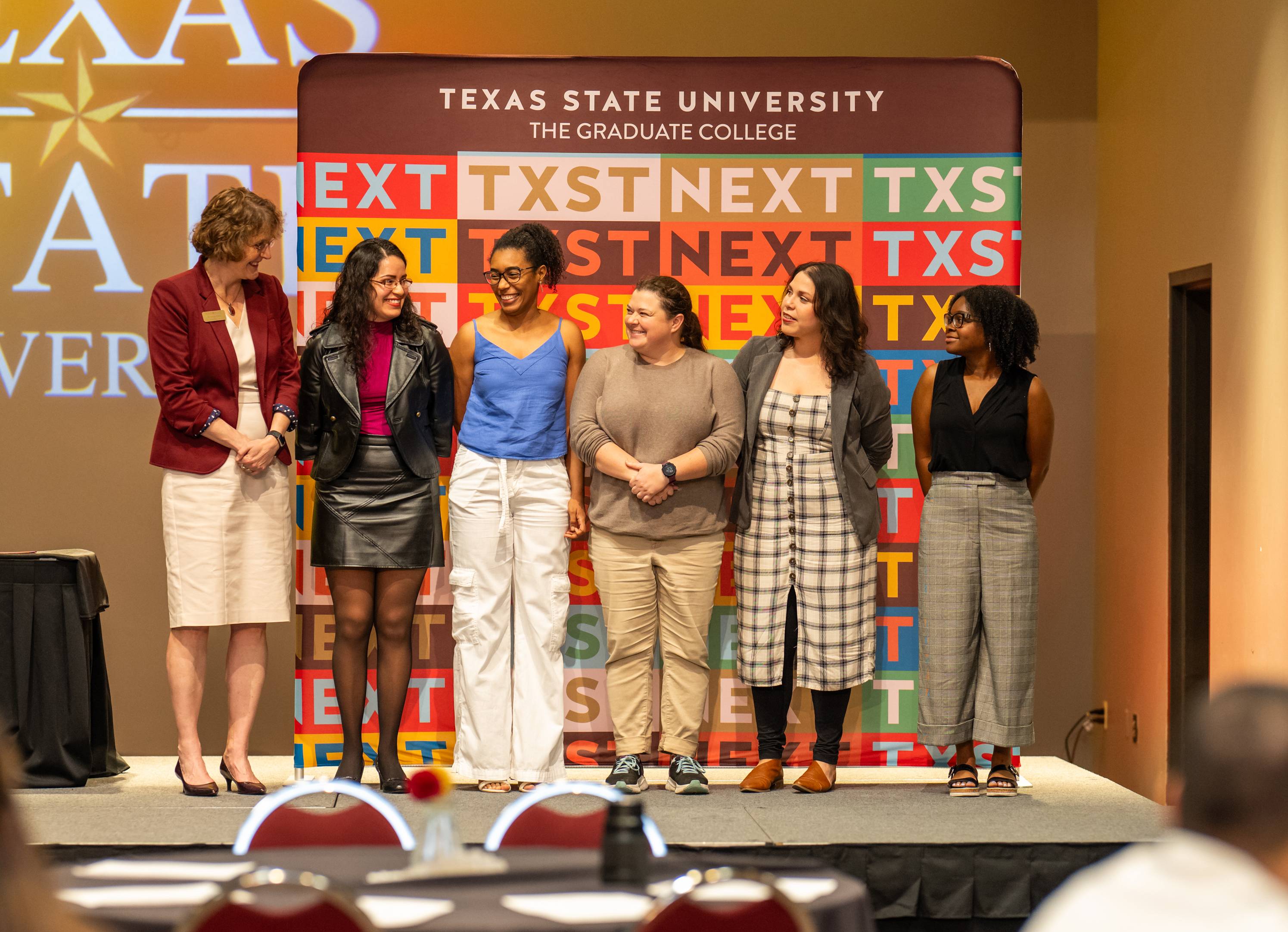 Dean Golato with graduate students at the 2024 Graduate College awards ceremony.
