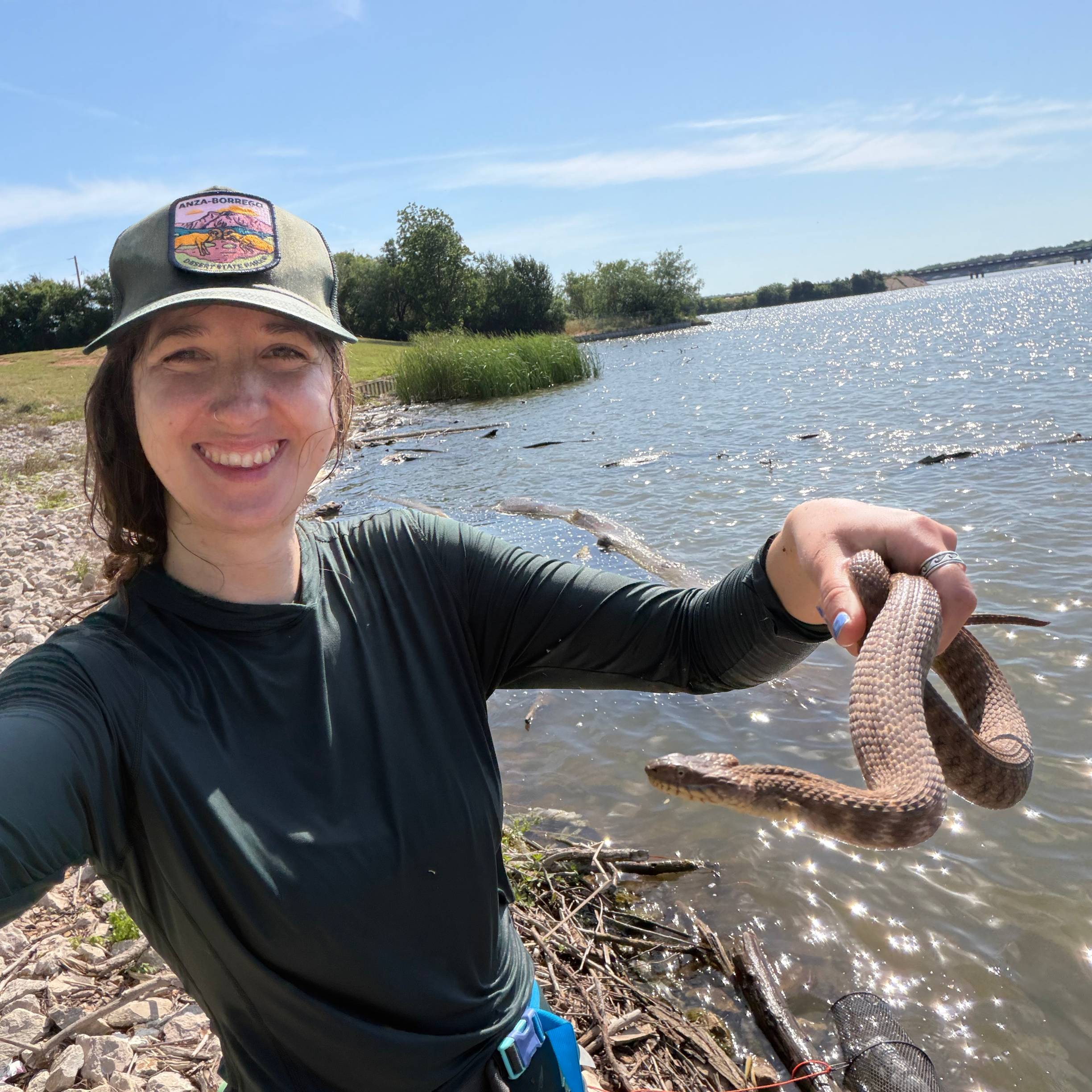 woman holding brazos water snake
