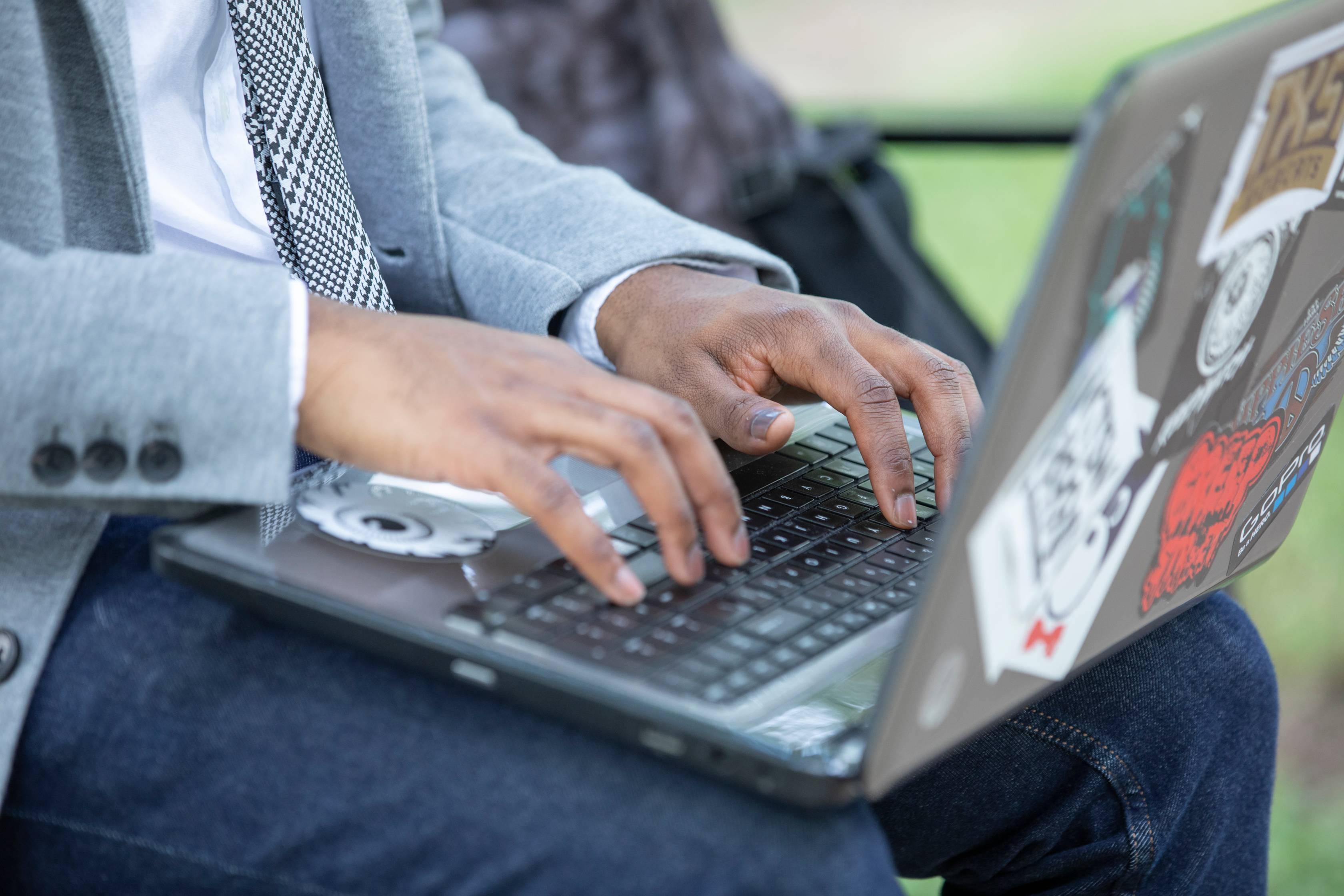 A person typing on the computer