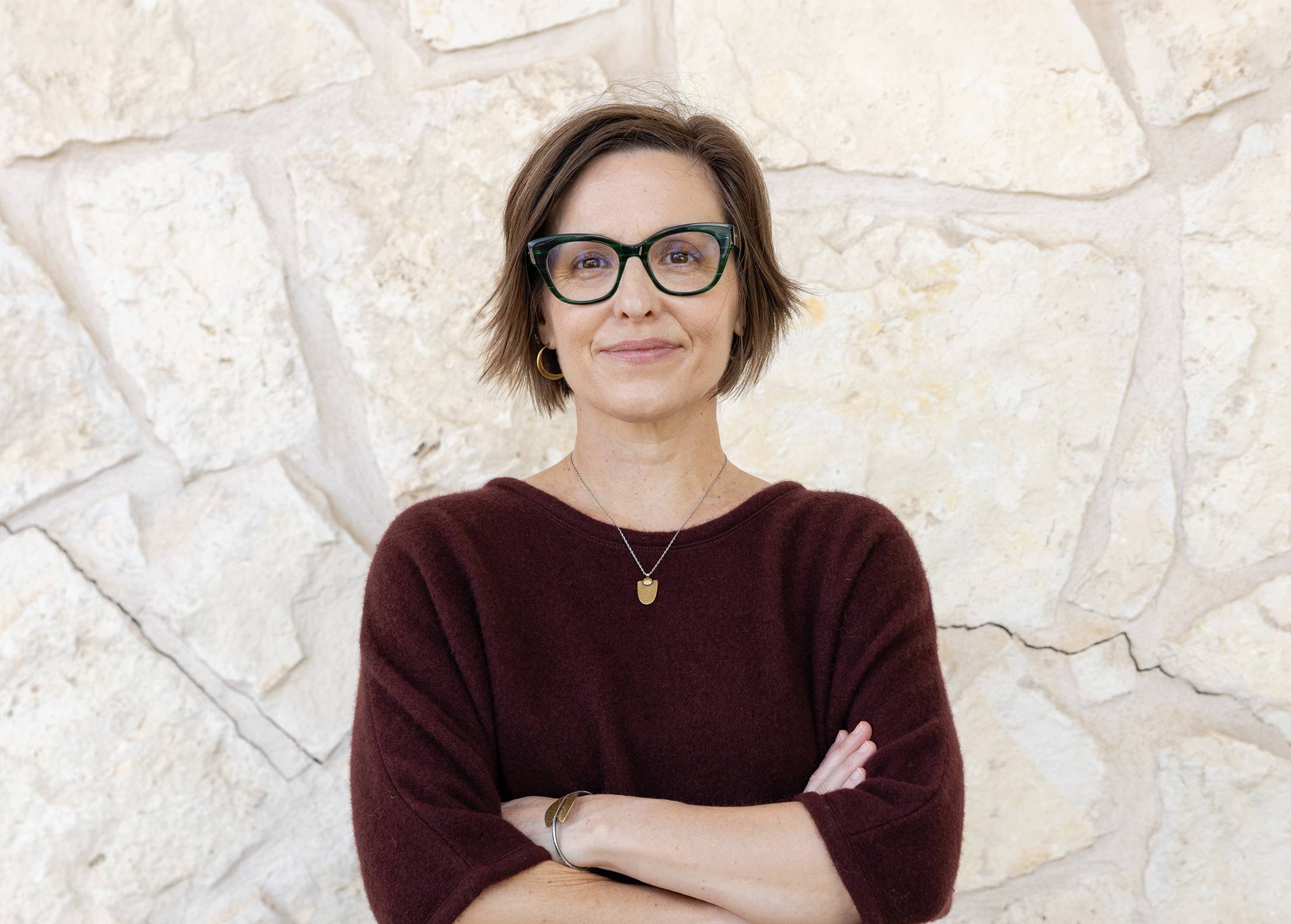 kate spradley standing with arms folded