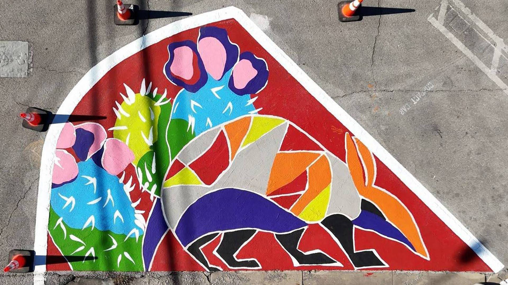 Artistic painting of armadillo on road