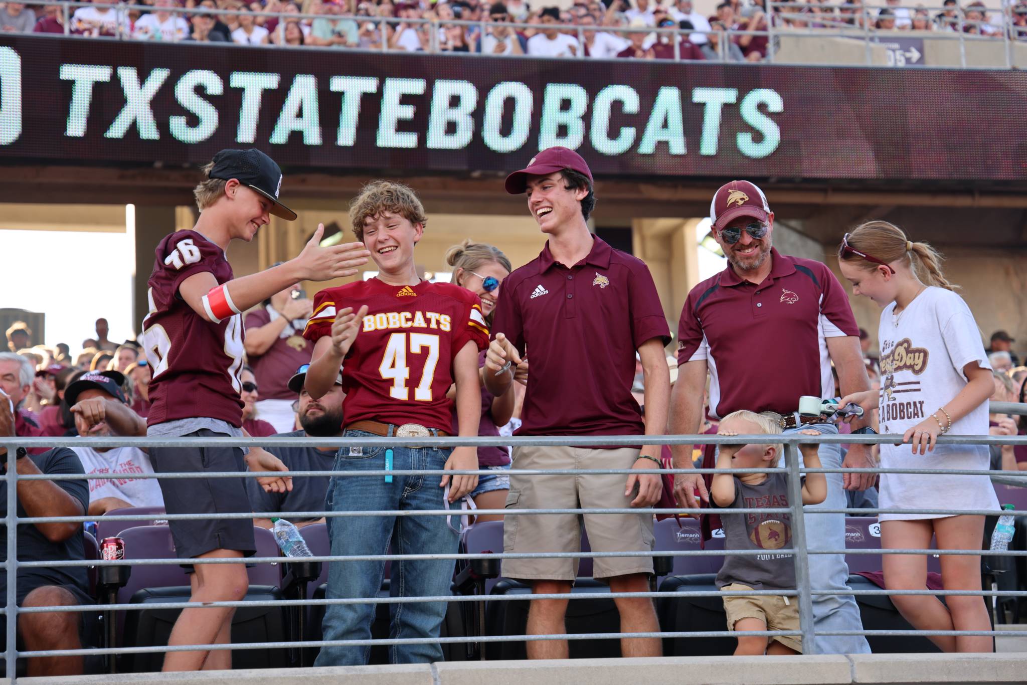 Family cheering at football game