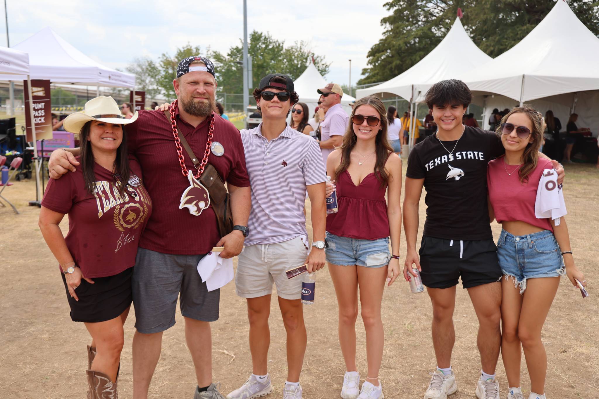 Families at tailgate in bobcat apparel