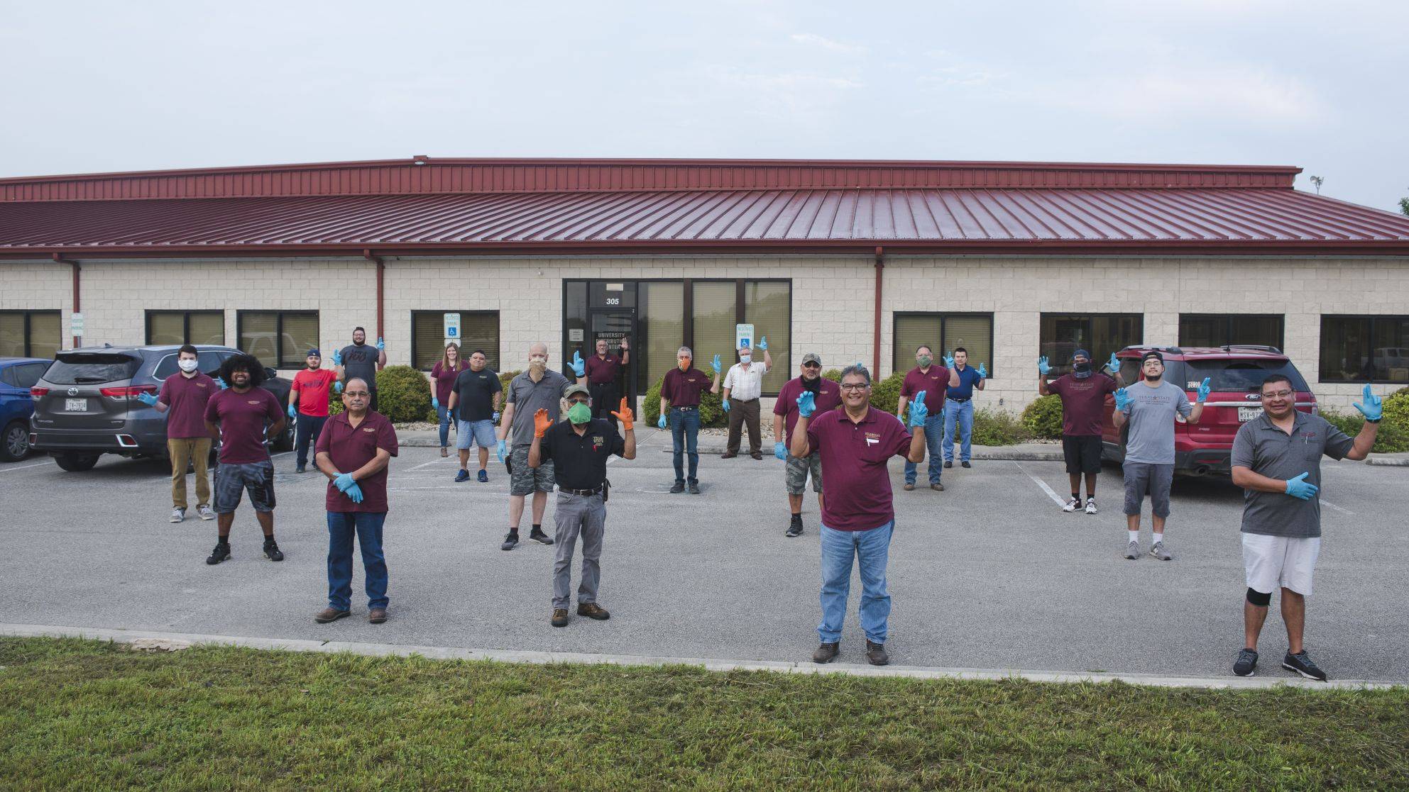 Employees standing in front of the University Distribution Center.