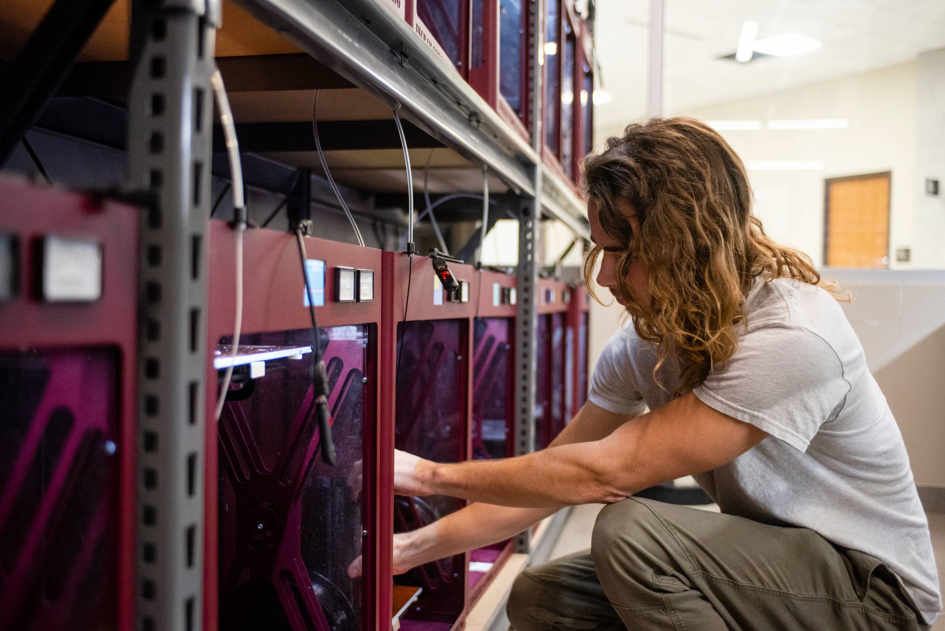 A person working in a server room
