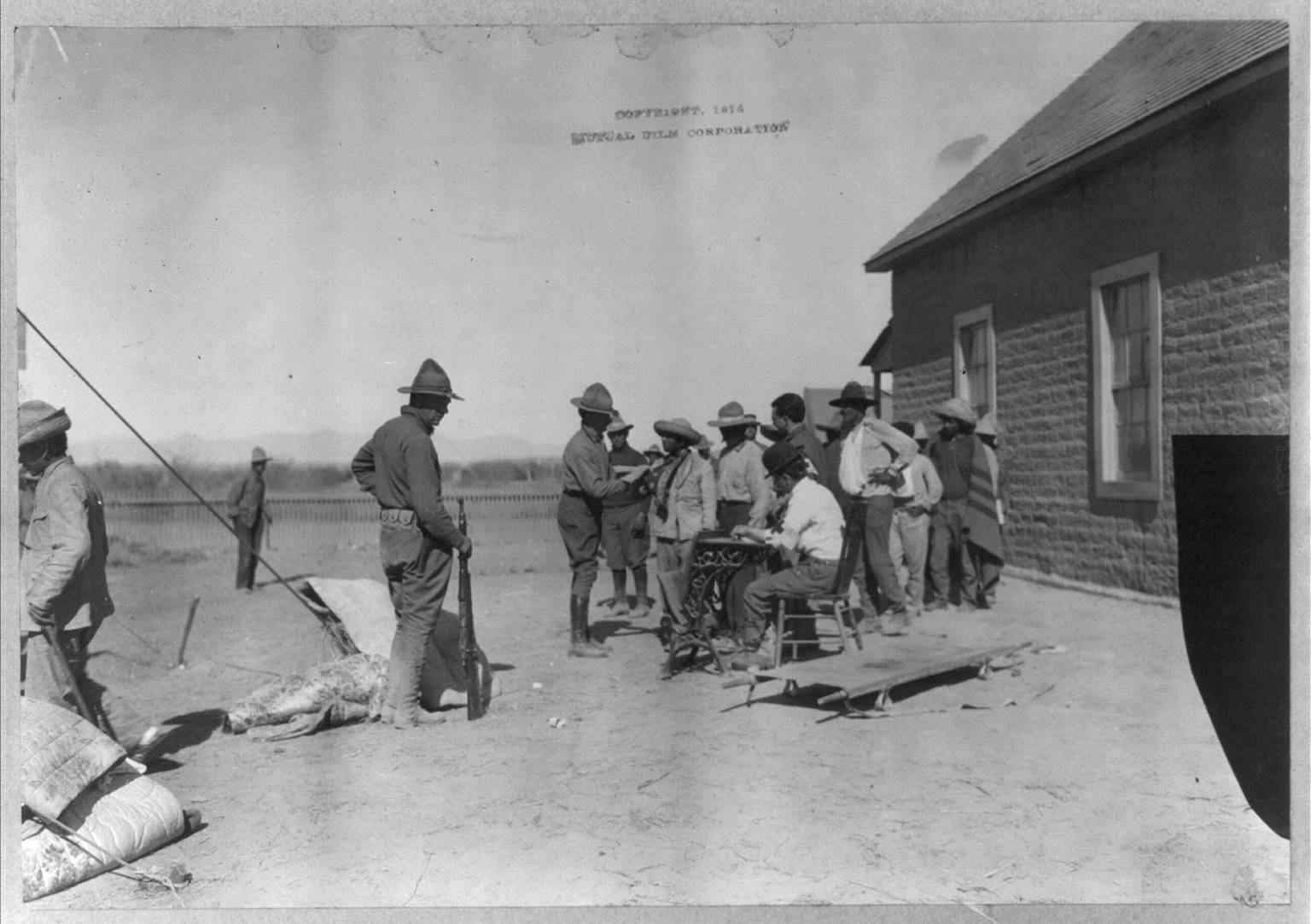 U.S. soldiers interviewing Mexican refugees