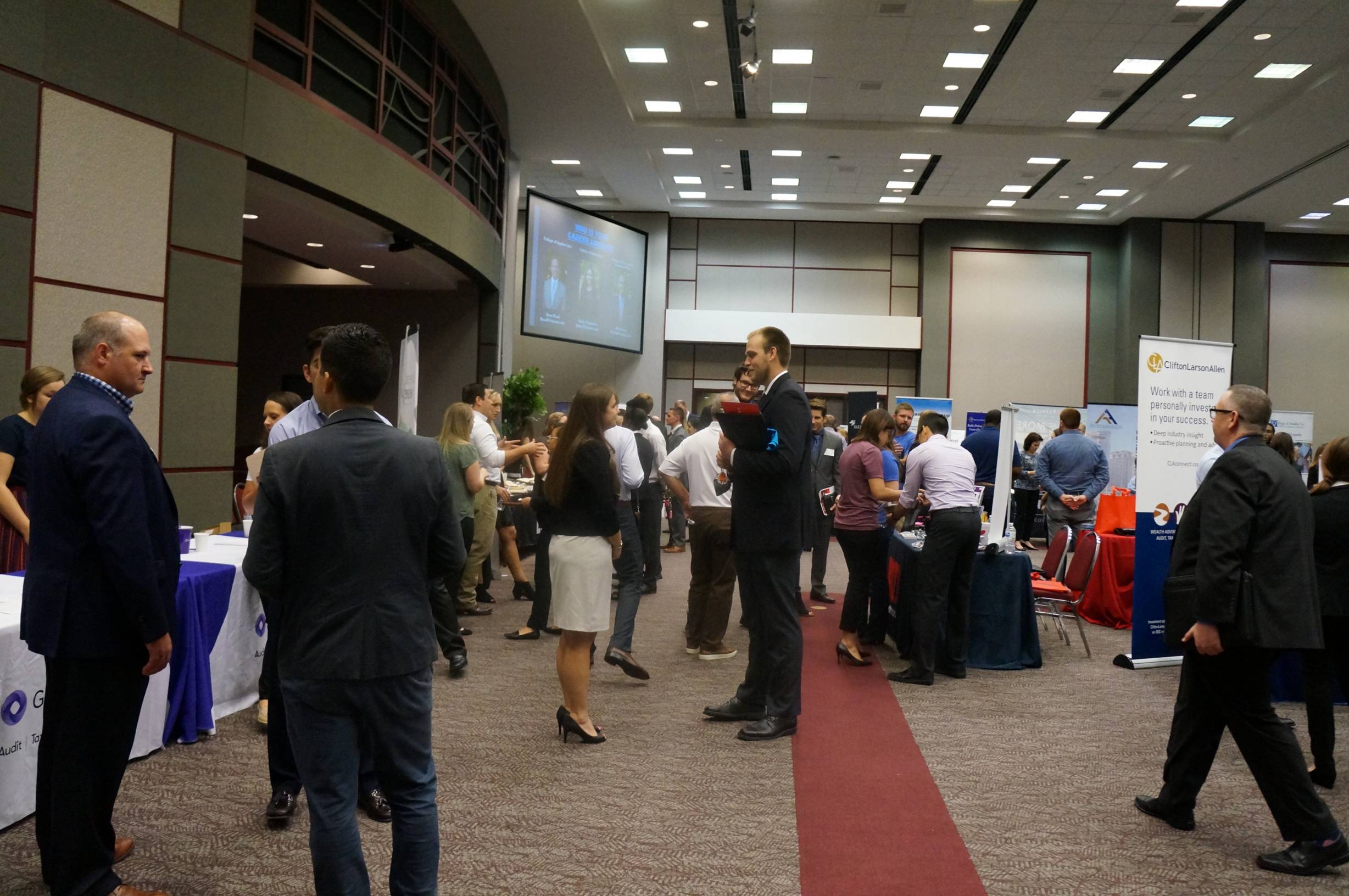 people in the atrium for meet the firms