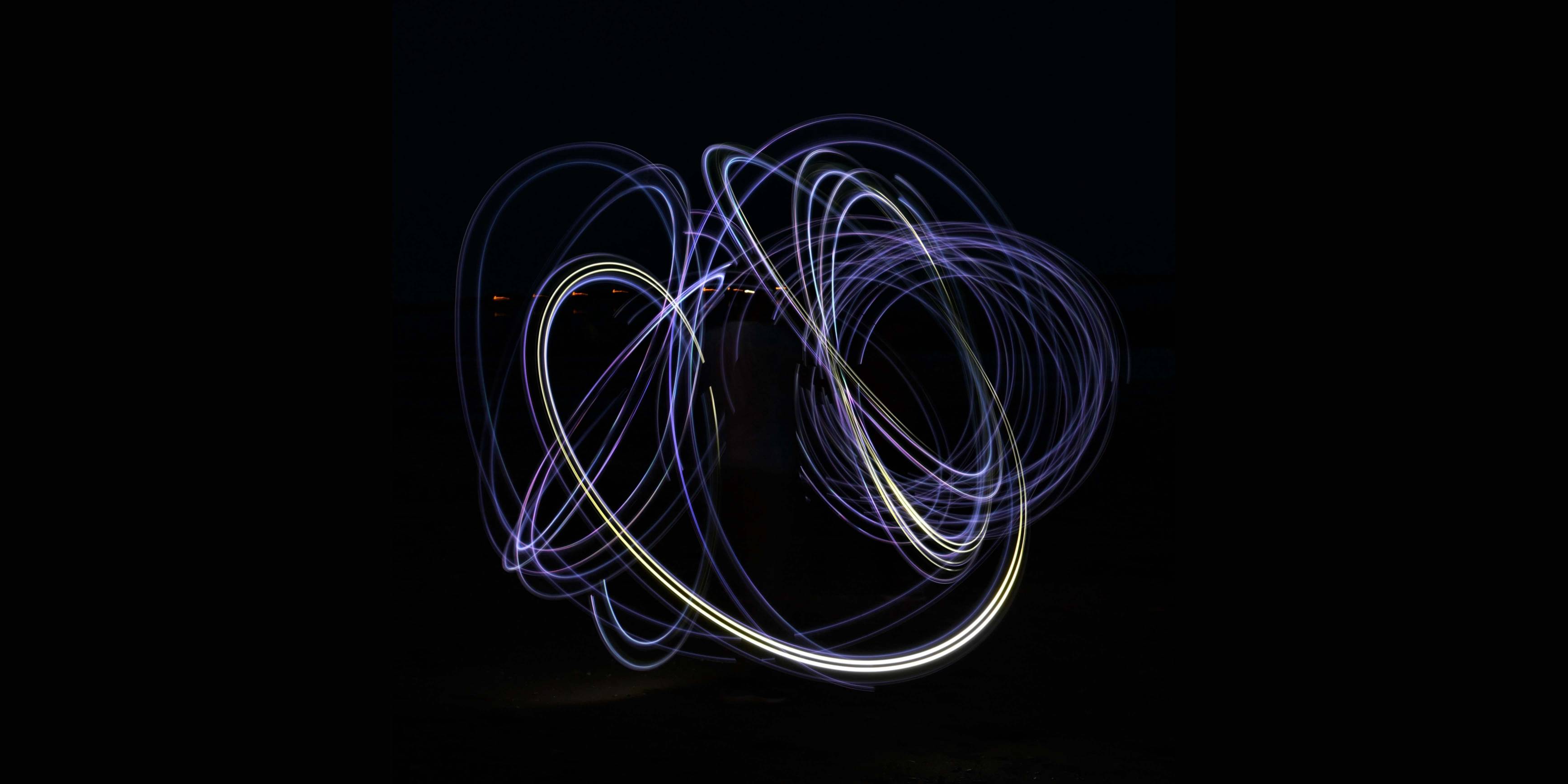 Circles created by long exposure photograph of someone moving a light around in the air.